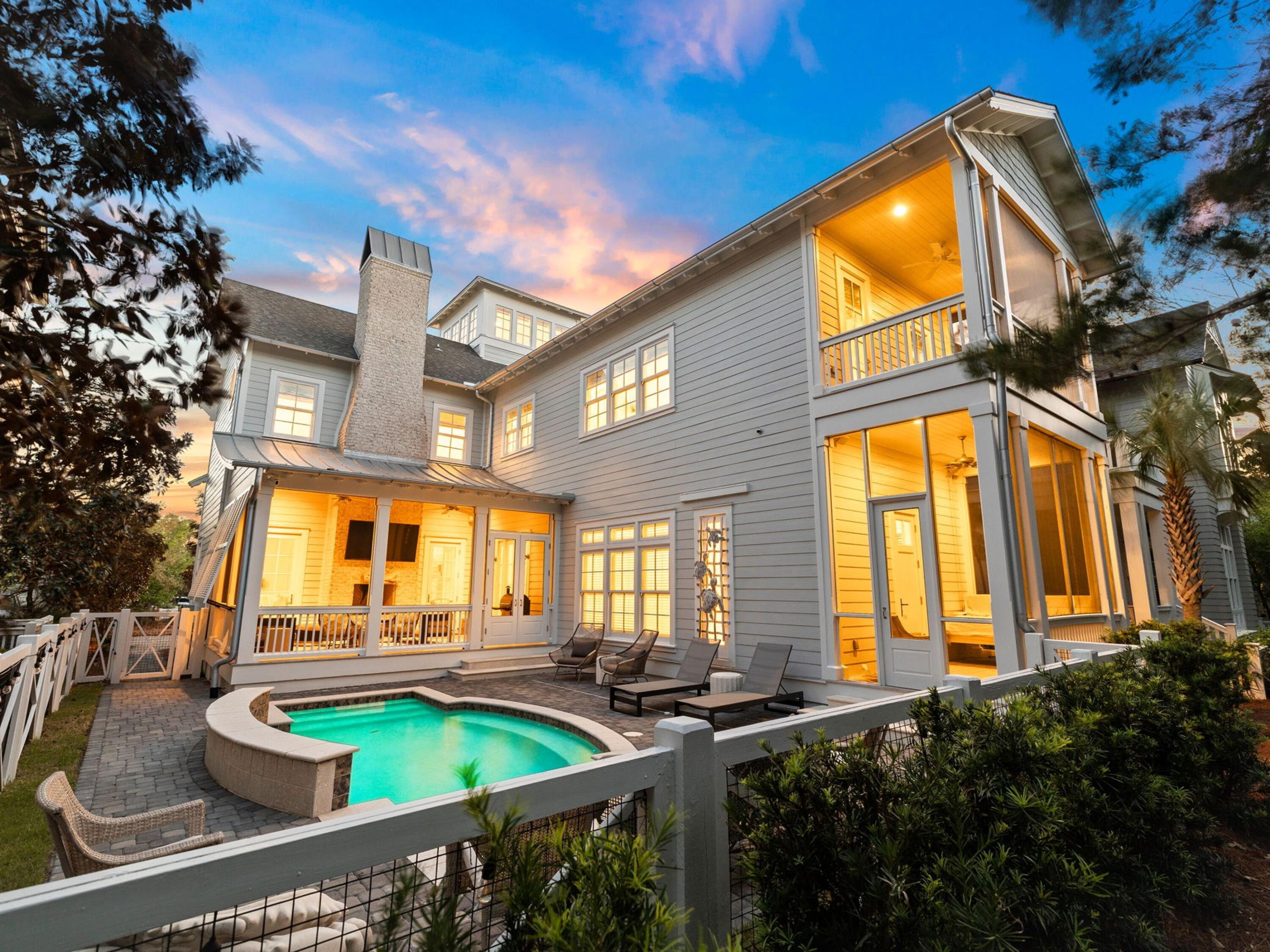 Tucked behind the hedges of WaterSound Beach, 44 Tidepool Lane occupies one of the community's most desirable homesites, overlooking Puttering Park and just a short stroll from the sugar-white sand and Gulf. Offering a private heated pool, multiple outdoor living spaces, and four levels of thoughtfully designed living space, this home presents an exceptional opportunity in one of 30A's most sought-after gated communities. The first floor is designed for effortless coastal living, featuring a spacious open-concept great room with a tabby fireplace, exposed wood beams, shiplap accents, and whitewashed oak floors. The chef's kitchen is equipped with Viking and Signature Series appliances, custom cabinetry, a pot filler, built-in ice maker, and generous prep space for entertaining. A private first-floor primary suite opens to its own screened porch and ensuite bath.

Upstairs, you'll find a guest suite with a morning kitchen and balcony, a spacious third-floor lounge, a custom-built bunk room, an additional guest suite with an ensuite bath and balcony, and a second primary suite overlooking Puttering Park. The fourth-floor tower provides additional flexible sleeping or recreation space.

Outside, the oversized screened porch overlooks the heated pool and sun deck, creating the perfect place to relax after a day at the beach. Recent improvements include a redesigned screened porch, repositioned windows to enhance views, a new pool deck, fresh interior and exterior paint, and a custom bunk room.

Whether you're searching for a full-time residence, second home, or investment property, 44 Tidepool Lane offers an exceptional combination of location and value within WaterSound Beach--a rare opportunity in one of 30A's premier coastal communities.