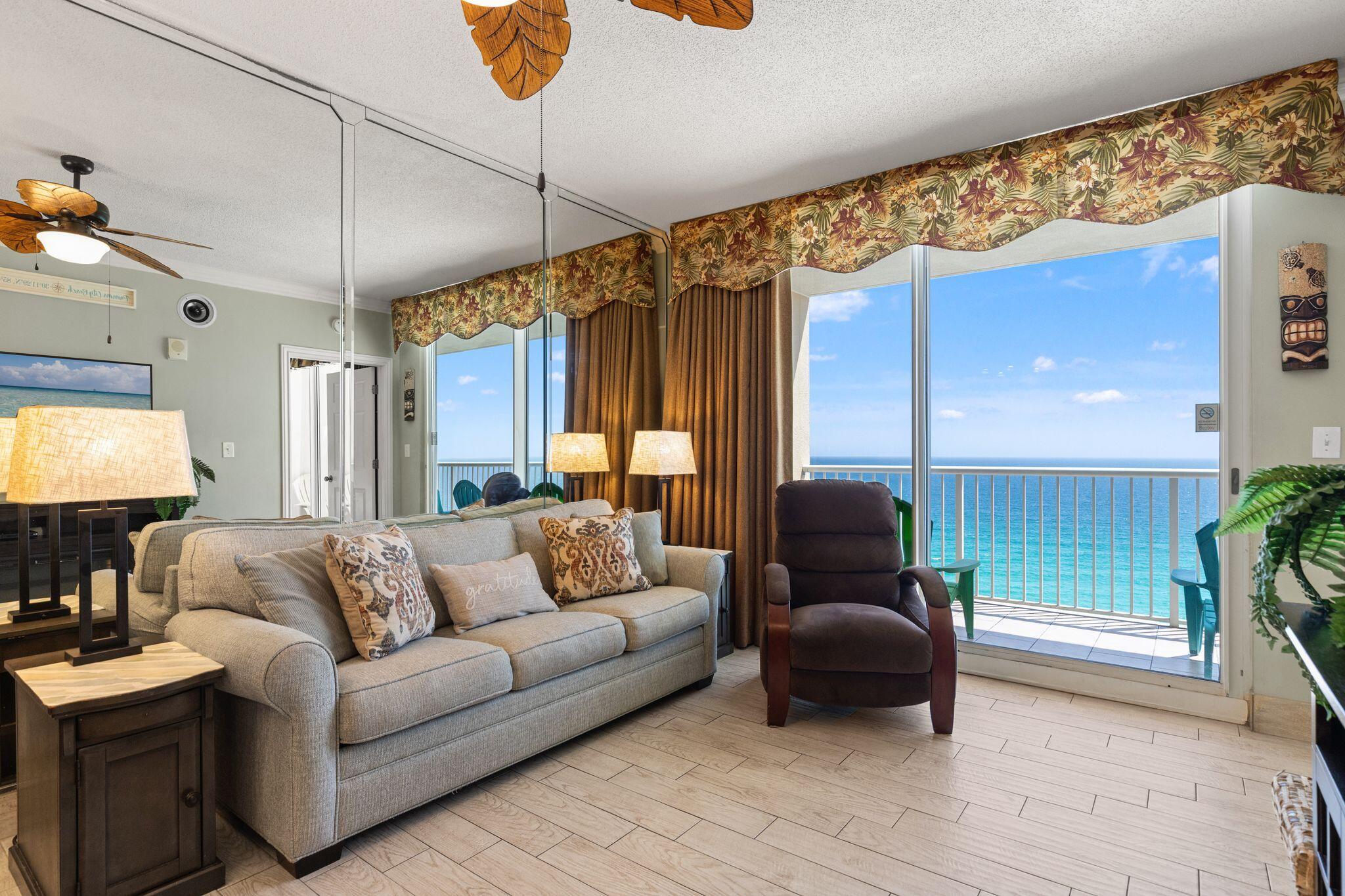 Welcome to Majestic Beach Towers #2-1305 -- a beautifully upgraded, fully furnished Gulf-front condo with strong rental history and stunning resort amenities. This spacious unit features wide white tile plank flooring and matching tile baseboards throughout ($15,000 upgrade), a tiled Gulf-front balcony, upgraded Corian countertops, white ceramic sinks, designer faucets, wine cooler, electric fireplace, and elegant floor-to-ceiling mirrors in the den and primary bedroom. Recent updates include solar insulation window film on balcony doors/windows (2025), new water heater (2025), new microwave (2025), Nest thermostat, and Ring doorbell. Owners and guests enjoy five pools, hot tubs, fitness center, tennis and pickleball courts, movie theater, on-site dining, covered parking, 24/7 security, and 650 feet of direct beach access at Majestic Beach Towers. The HOA is fully funded with no history of special assessments and is considered one of the best-managed on the beach. Conveniently located near shopping, dining, and entertainment, this condo is ideal as a vacation rental, full-time residence, or personal beachfront retreat.