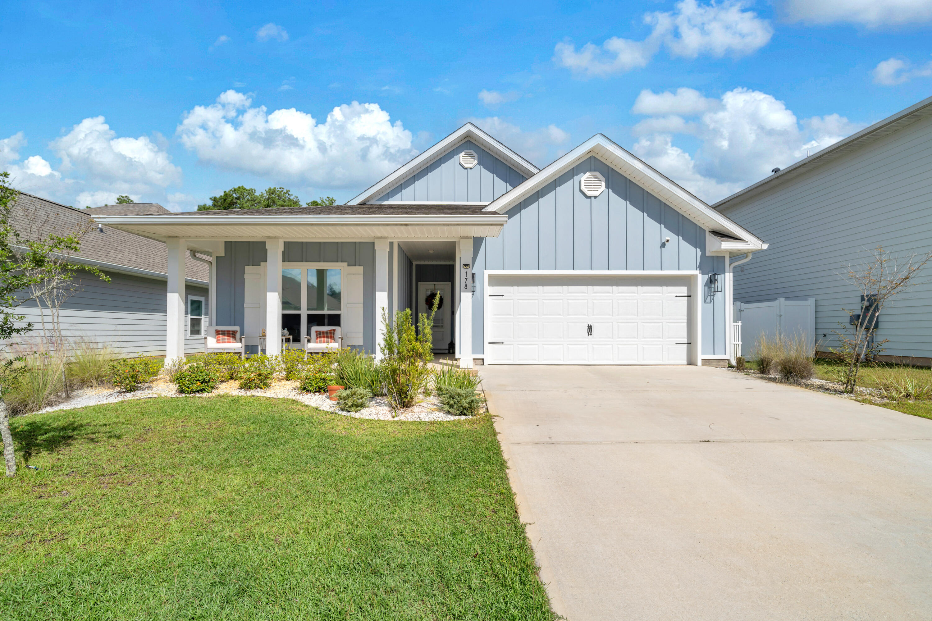 Priced BELOW market value! Meticulously maintained and loaded with upgrades, this home offers a rare combination of coastal charm, modern convenience, and outstanding investment potential. It's well suited for a primary residence, second home, or vacation rental portfolio with projected short-term rental income exceeding $60,000 annually. 
Thoughtfully enhanced far beyond builder-grade standards, the owners have invested in quality and craftsmanship throughout. The attention to detail is evident from the moment you step inside, where tasteful board and batten accents, designer light fixtures, upgraded ceiling fans, and a custom built-in fireplace create a warm and inviting living space. The open kitchen features quartz countertops, stainless steel appliances, a spacious walk-in pantry, and is complemented by a premium whole-house water filtration system with under-sink reverse osmosis. The primary suite offers a private retreat with dual closets enhanced by custom built-in storage systems, while a recently upgraded dishwasher adds everyday convenience. Outside, the upgrades continue with a screened-in porch, retaining wall, and a white vinyl privacy fence that creates a secluded backyard oasis overlooking a peaceful wooded setting. Located in Walton's Landing, residents enjoy a resort-style pool, cabana, grilling area, and nature trails, all with low HOA dues of just $116 per month. The location is equally impressive being only six miles from the sugar-white sands and emerald waters of 30A at Ed Walline Beach Access, with convenient public parking, shopping, and dining at Gulf Place. Kellogg Bayside Park, with its kayak launch and picnic area, is just one mile away, while Sandestin, medical facilities, and everyday shopping are all within a short drive. 

Properties that combine extensive upgrades, a private setting, and strong investment potential are hard to find. Schedule your private showing today. A video tour is also available
