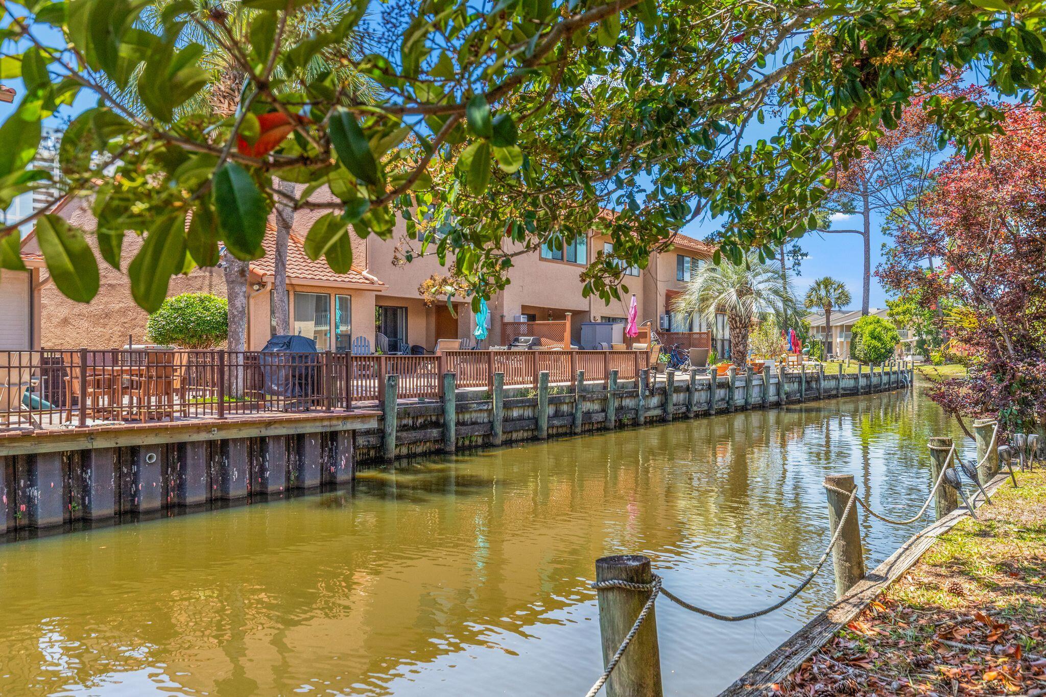 Waterfront under 300K!? This is the opportunity you have been waiting for. 
Welcome to this well maintained 2 bedroom 2.5 bath beach home offering a great combination of privacy, location, and value. Situated on the canal, you can enjoy peaceful water views and natural surroundings while relaxing or grilling in the evenings. There is also a pool located directly across the street for added convenience.
Located just a short 5 minute walk to the beach, this home puts you close to the sand while still offering a quiet setting. Inside, the property features updates including granite countertops in the kitchen and half bath, LVP flooring, and a comfortable layout ready for personal use or rental. Additional highlights include short term rentals allowed with strong GRI potential, VA and FHA approval, low HOA, and 2 assigned parking spaces directly in front of the unit.
The community amenities are extensive and included in the HOA of 1121.84 per quarter. These include 11 pools with 5 heated, a private beach house with beachfront pool and snack bar, tennis, pickleball and shuffleboard courts, fitness center, mini golf, playgrounds, conference center, as well as internet, lawn care, trash, pest control, and termite bond.
Whether you are looking for a primary residence, vacation home, or investment property, this waterfront unit offers strong value in a desirable beachside community.