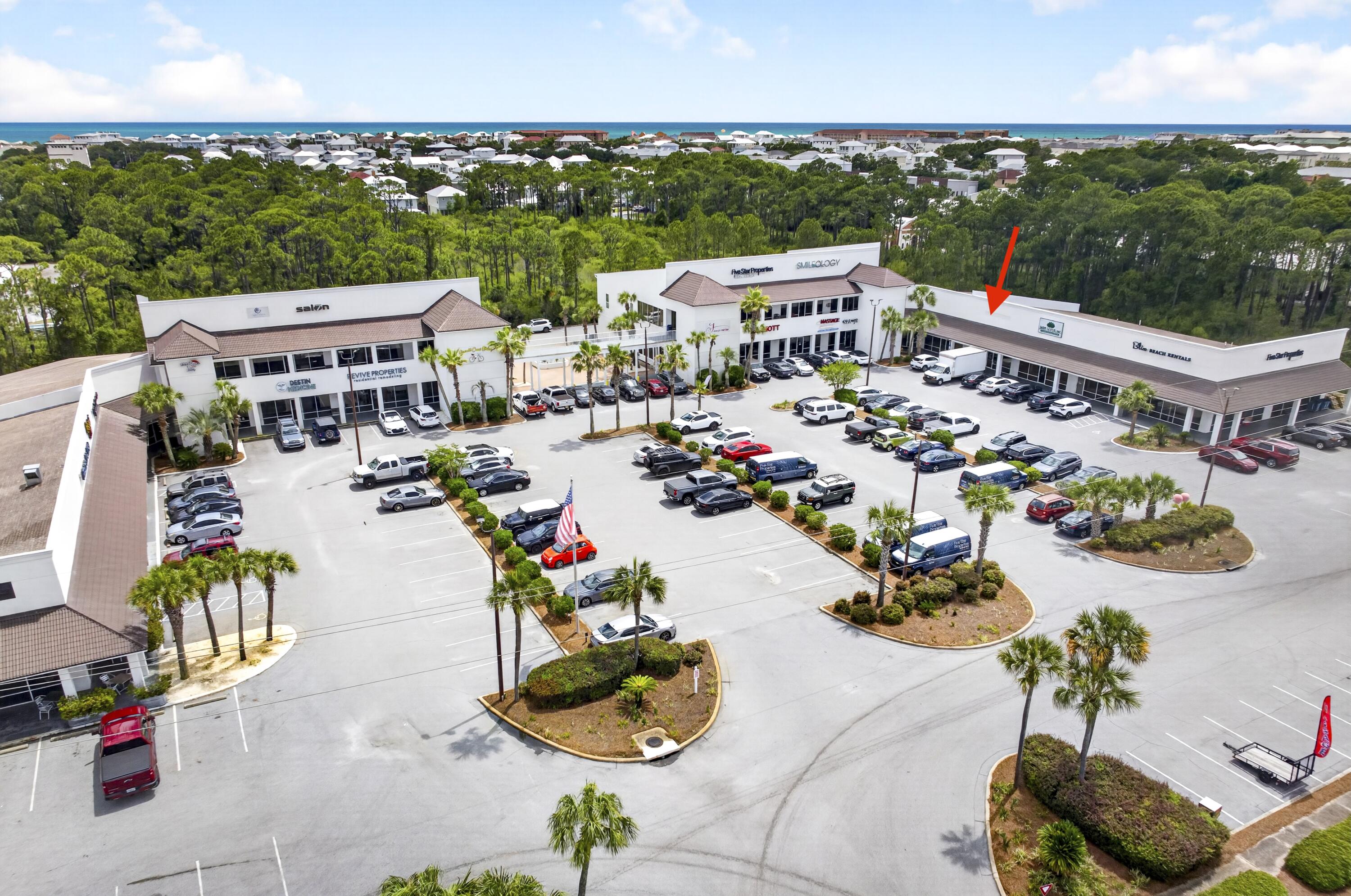 Unit 119 at Holiday Plaza is now available for purchase and offers approximately 1,500 square feet of versatile commercial space in one of Miramar Beach's most established and highly trafficked shopping centers. Currently owner-occupied by a luxury vacation rental management company, the space will be available for occupancy in September 2026. The unit is presently utilized for office, storage, and laundry operations and can easily accommodate a variety of retail, office, service, warehouse, or light commercial uses. Existing utility infrastructure may also make the property attractive for a future laundry operation, although all washers and dryers are excluded from the sale.

The space features durable tile flooring throughout, a remodeled break room, and an updated restroom. A covered rear loading area provides convenient access for deliveries and day-to-day operations, while a lockable covered storage shed offers valuable additional storage space rarely found in comparable units. Holiday Plaza benefits from a strong mix of restaurants, dental offices, salons, professional services, and retail businesses that generate consistent daily traffic throughout the center. The property offers abundant parking, excellent visibility, and convenient ingress and egress directly from Emerald Coast Parkway (US Highway 98). This is a rare opportunity to acquire a well-maintained commercial unit in the heart of Miramar Beach with strong surrounding businesses, excellent accessibility, and flexible future use potential.