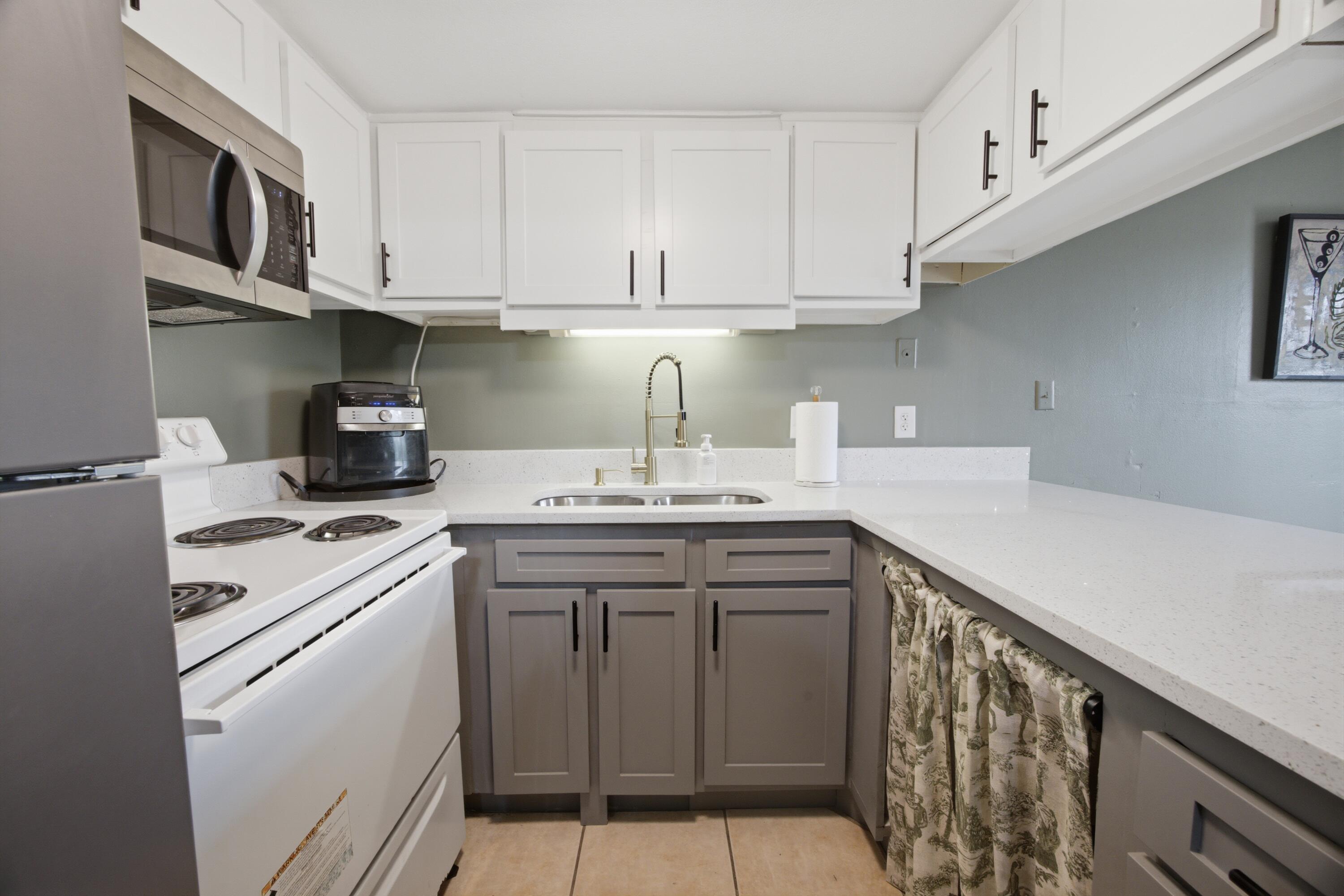 WATERFRONT COMMUNITY • NEWLY RENOVATED KITCHEN • NO SHORT-TERM RENTALS! Welcome to Fountainhead Condominium Complex, a waterfront community conveniently located on Miracle Strip Parkway in Fort Walton Beach. This bottom-floor, 1-bedroom, 1-bath condo offers easy, low-maintenance coastal living with tile flooring throughout and a beautifully renovated kitchen completed in August 2026.

The kitchen features refaced cabinets with new doors, paint and hardware, a new undermount stainless-steel sink and faucet, quartz countertops extended to create convenient bar seating, and a new over-the-range microwave. Window treatments are also in place, making this condo move-in ready.

Fountainhead offers an impressive selection of amenities, including a waterfront pool, clubhouse, game room, tennis and pickleball courts, laundry facilities, community dock, boat slips, fishing areas, dry boat storage, and picnic area. The HOA also provides water, trash service, and lawn maintenance, making everyday living even easier. Located along Miracle Strip Parkway, you're close to the Gulf beaches, shopping, restaurants, entertainment, and everything Fort Walton Beach and the Emerald Coast have to offer. Whether you're looking for a full-time home, a coastal getaway, or a low-maintenance place to enjoy the Florida lifestyle, this condo offers a great opportunity in a community where short-term rentals are not permitted.