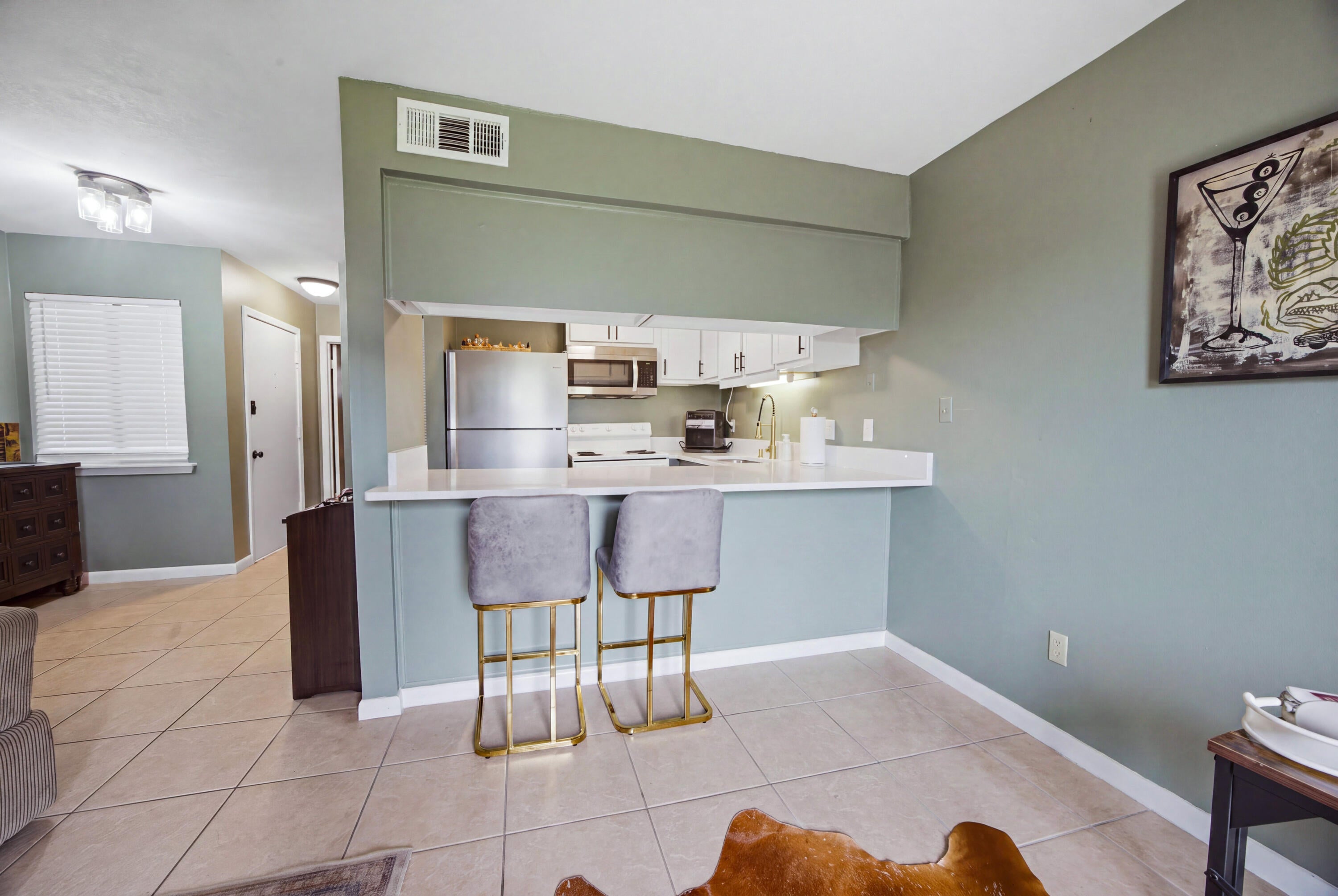 WATERFRONT COMMUNITY • NEWLY RENOVATED KITCHEN • NO SHORT-TERM RENTALS! Welcome to Fountainhead Condominium Complex, a waterfront community conveniently located on Miracle Strip Parkway in Fort Walton Beach. This bottom-floor, 1-bedroom, 1-bath condo offers easy, low-maintenance coastal living with tile flooring throughout and a beautifully renovated kitchen completed in August 2026.

The kitchen features refaced cabinets with new doors, paint and hardware, a new undermount stainless-steel sink and faucet, quartz countertops extended to create convenient bar seating, and a new over-the-range microwave. Window treatments are also in place, making this condo move-in ready.

Fountainhead offers an impressive selection of amenities, including a waterfront pool, clubhouse, game room, tennis and pickleball courts, laundry facilities, community dock, boat slips, fishing areas, dry boat storage, and picnic area. The HOA also provides water, trash service, and lawn maintenance, making everyday living even easier. Located along Miracle Strip Parkway, you're close to the Gulf beaches, shopping, restaurants, entertainment, and everything Fort Walton Beach and the Emerald Coast have to offer. Whether you're looking for a full-time home, a coastal getaway, or a low-maintenance place to enjoy the Florida lifestyle, this condo offers a great opportunity in a community where short-term rentals are not permitted.