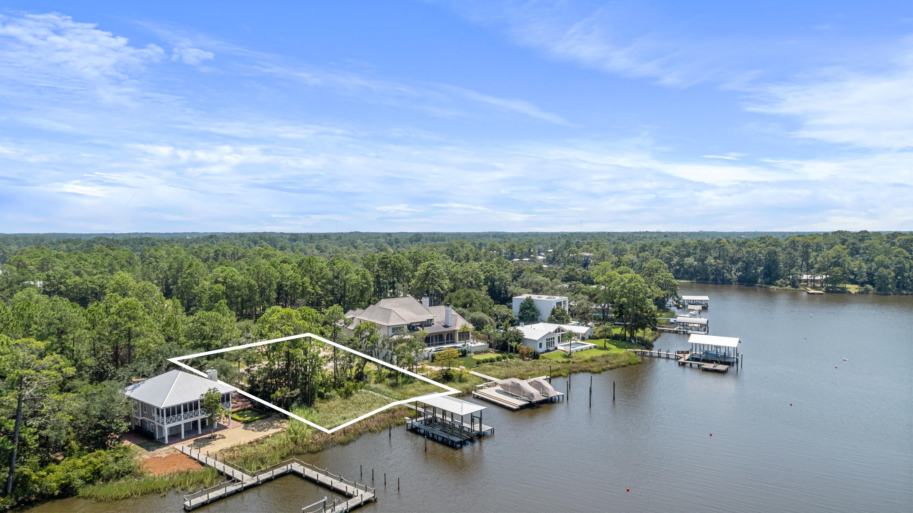 Welcome to Point Washington, a hidden gem offering ultimate privacy and superior location combined for exceptional waterfront living. With over one-half acre this stunning waterfront lot with existing dock is waiting for you to build your forever home. Where you are moments away from all the pleasures of Scenic Hwy 30A, the beautiful live oaks of Eden State Gardens and direct access to the waters of the Choctawhatchee Bay. Bring any size boat, the deep water of Tucker Bayou will lead you to Gulf and the enjoyment of the Choctawhatchee Bay, waterfront restaurants, fishing, boating, jet ski adventures, and the Intracoastal Waterway just around the corner.
