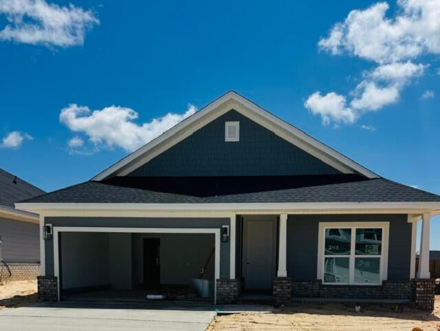 This popular Craftsman-style 3BR/2BA home (currently under construction: (Est. August / Sept. N ext to the entrance of the community (across from model). Designed with both comfort and style in mind, the home features HardieBoard® siding with a brick skirt, vaulted ceilings,  and CoreTec Pro Plus luxury vinyl plank flooring throughout--no carpet. The spacious primary suite boasts elegant tray ceilings, a generous walk-in closet, and a spa-inspired bath. Quartz countertops in the kitchen and baths, soft-close cabinetry, spacious covered patio complete this inviting home, perfect for relaxed everyday living and entertaining. Bluffs residents enjoy a community pool, and bathhouse, near the Florida Trail offering plenty of opportunities to get outside and enjoy the Florida life style.  *Pics are of a similar home.*
