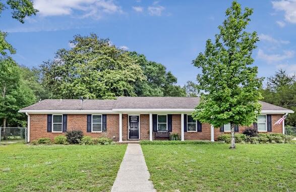 Charming and well-kept 3 bedroom, 2 bathroom brick home situated on a generous .51-acre lot in a quiet, established neighborhood just off Hwy 90 East. With 1,267 square feet of living space and an oversized 2-car garage, this home offers both comfort and practicality.

Inside, you'll love the inviting living area featuring a cozy wood-burning fireplace and a split floor plan designed for added privacy. A separating door allows the secondary bedrooms and bathroom to be closed off from the main living space, perfect for guests or children. 

The home has been very well maintained and features several updates completed within the last 5 years, including new carpet, fresh paint, gutters, and shutters. The spacious fenced backyard provides plenty of room for entertaining, pets, or outdoor activities.

Seller is aware the home needs a new roof and is willing to replace it at closing with an acceptable offer.

Buyer to verify all room and lot dimensions.