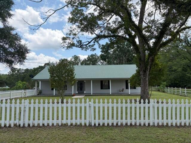 More Than Just a House-This is  Peaceful Country Living at its  Best!

Escape the hustle and enjoy the perfect blend of privacy ,nature ,and convenience in this beautiful, well-maintained  2440 square foot , 3-bedroom,2-bath  single family home nestled in scenic Baker. Whether you are enjoying your morning coffee on the spacious covered front porch, spending time outdoors ,or simply appreciating the peaceful surroundings near the pond, this home  offers a  lifestyle that is becoming harder and harder to find . 
The property also features garage-style storage and parking, additional separate carport, and storage sheds, providing plenty of space for vehicles, tools and outdoor equipment.
 Perfect for families, outdoor enthusiasts, or anyone looking for a quiet country retreat with room to breathe while still being close to shopping, restaurants ,schools and everyday conveniences. Schedule your showing today!
Pet restriction: one pet only; limited to small breed.