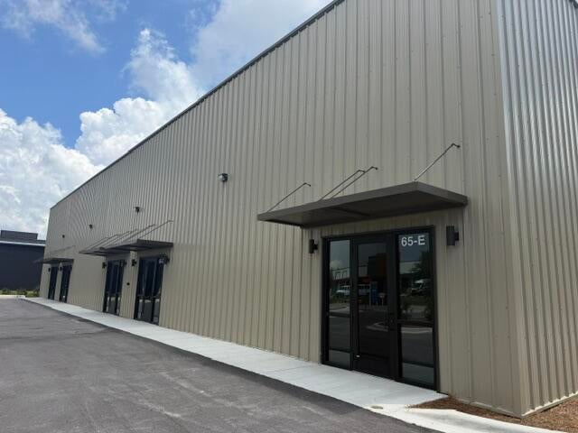 Brand new commercial space at 65 Gordonia Way in Santa Rosa Beach, located in the South Walton Commerce Park. This property features five brand new 2,000 SF units, each available now for $3,335 per month NNN. Each unit offers 20' ceilings, a 16' rollup door, and a private restroom, providing flexible space for a variety of business, warehouse, showroom, service, or storage uses. Conveniently located just minutes from the beaches and Scenic 30A, this is an excellent opportunity to establish or expand your business in one of South Walton's most desirable and rapidly growing areas. Brand new construction, functional design, high ceilings, , and immediate availability make these units an exceptional commercial opportunity.