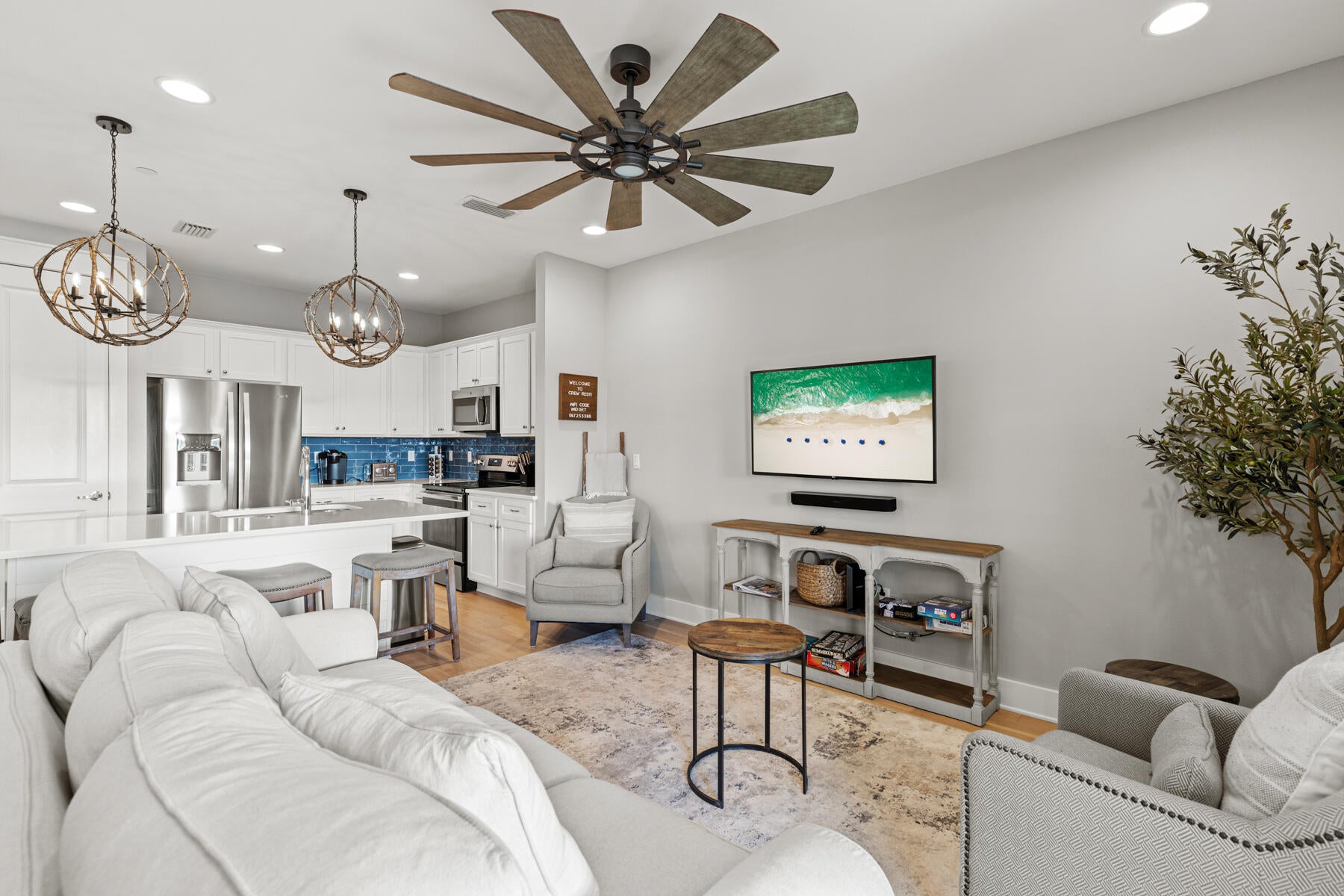 ''Crew Rest'' is a stunning beach townhome on 30A that was just recently repainted.  Just 2 miles east of Seaside near the Eastern Lake public beach access, this property, one of 26 units and located in building ''E'', comes fully furnished and rental ready for immediate occupancy.  Just bring your toothbrush!
Upon entering, you're welcomed by a charming coastal-themed foyer leading to a custom hallway bunk nook. Two additional bedrooms are straight ahead: one with custom-built twin XL bunks with an extra trundle, and another with a king-size bed with direct access to an inviting outdoor patio, perfect for barbecuing and relaxing by the fire pit. The first floor also includes a washer/dryer and access to a one-car garage, which INCLUDES A GOLF CART THAT STAYS WITH THE HOME!