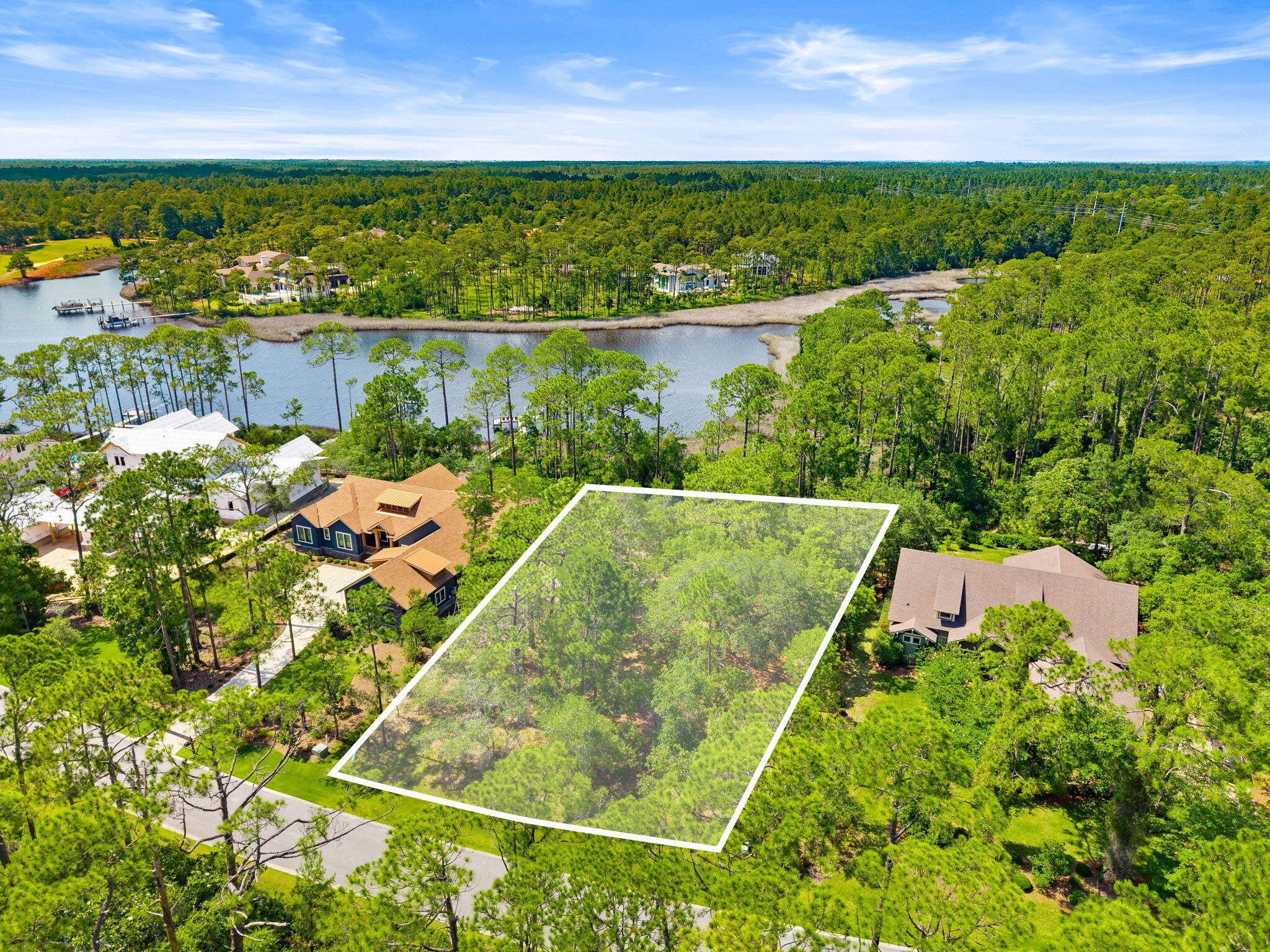 Build your dream home at Lake Powell with great water views, in the prestigious gated community of Wild Heron on this beautiful homesite located on Marsh Rabbit Run. Nestled among mature pines and native Florida landscape, this private lot offers the perfect setting to create a custom residence while enjoying the natural beauty that makes Wild Heron one of Northwest Florida's most sought-after communities.
Ideally situated near Lake Powell, Florida's largest coastal dune lake, this homesite is surrounded by luxury custom homes and offers a peaceful setting with nature views and convenient access to the community's world-class amenities. Residents enjoy access to the fitness center, resort-style pool, lakeside boathouse, walking and biking trails, playground, and community dock. Wild Heron is also home to the renowned Sharks Tooth Golf Course, designed by Greg Norman.
Located just minutes from the white-sand beaches of the Gulf of Mexico, 30A, shopping, dining, and entertainment, this is a rare opportunity to build in a community that perfectly blends luxury living with Florida's natural beauty.
Located in the gated Wild Heron community
Situated on desirable Marsh Rabbit Run
Surrounded by mature trees for privacy and natural beauty. Near Lake Powell and community amenities
Access to resort-style pool, fitness center, tennis courts, trails, and community dock
Home to the Greg Norman-designed Sharks Tooth Golf Course. Minutes from Panama City Beach, Scenic 30A, & dining.