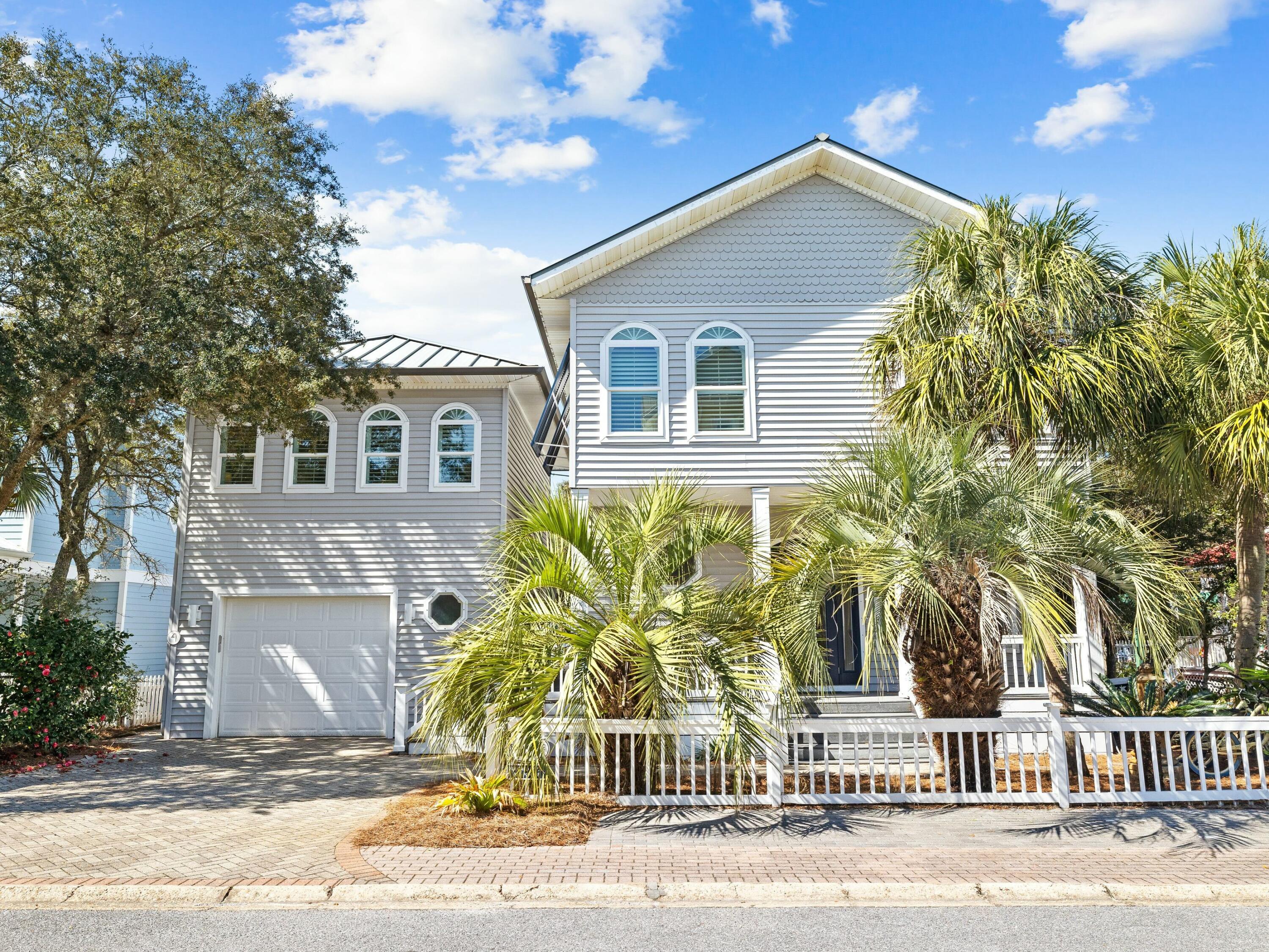 Enjoy stunning Gulf views from this beach home in the private, gated community of Old Florida Beach. Just three houses from the sand, the property includes a main home with three bedrooms (each with its own bath), a bunk room, and a lookout tower with panoramic views. The open living, kitchen, and dining area is designed for gathering, while the landscaped backyard offers shaded space for relaxing outdoors. A detached garage features a one-bedroom carriage house with full kitchen.
Old Florida Beach offers a private beach, heated community pool, Draper Lake dock, and three beach accesses. Perfect as a primary home or vacation rental.
