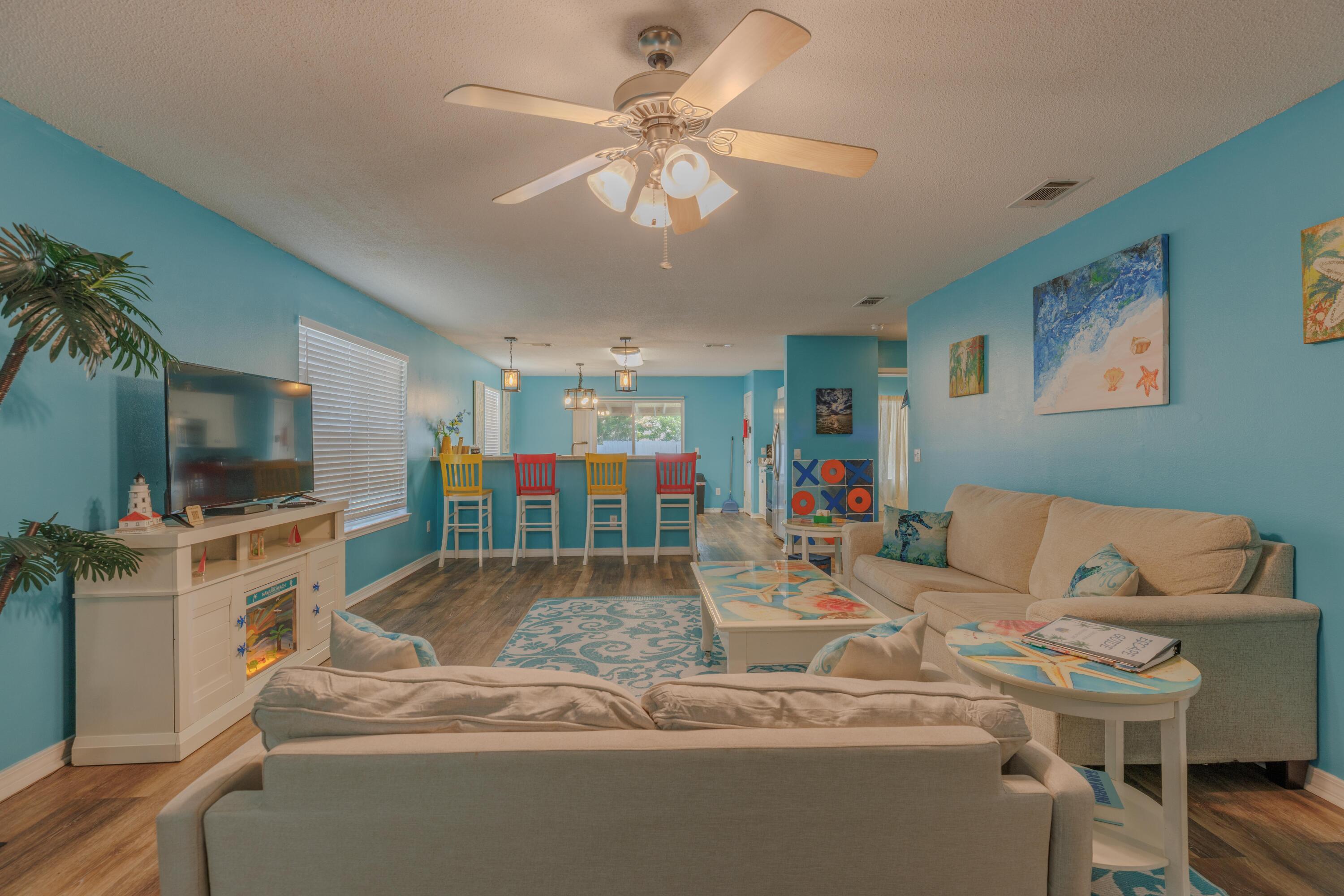 Turnkey short term rental opportunity in the heart of Navarre! This fully furnished, move in ready home has been successfully operating as a licensed vacation rental with strong rental history, excellent guest reviews, and proven income potential. Featuring fully paid-off solar panels with net metering for low utility costs, a climate-controlled garage with a newer mini split system, and recently replaced carpeting, this home is designed for comfort and efficiency. Enjoy a charming mini orchard with producing pear, peach, and orange trees, all while being conveniently located near beaches, shopping, dining, and local attractions. Ideal as an income producing investment, vacation home, or primary residence.