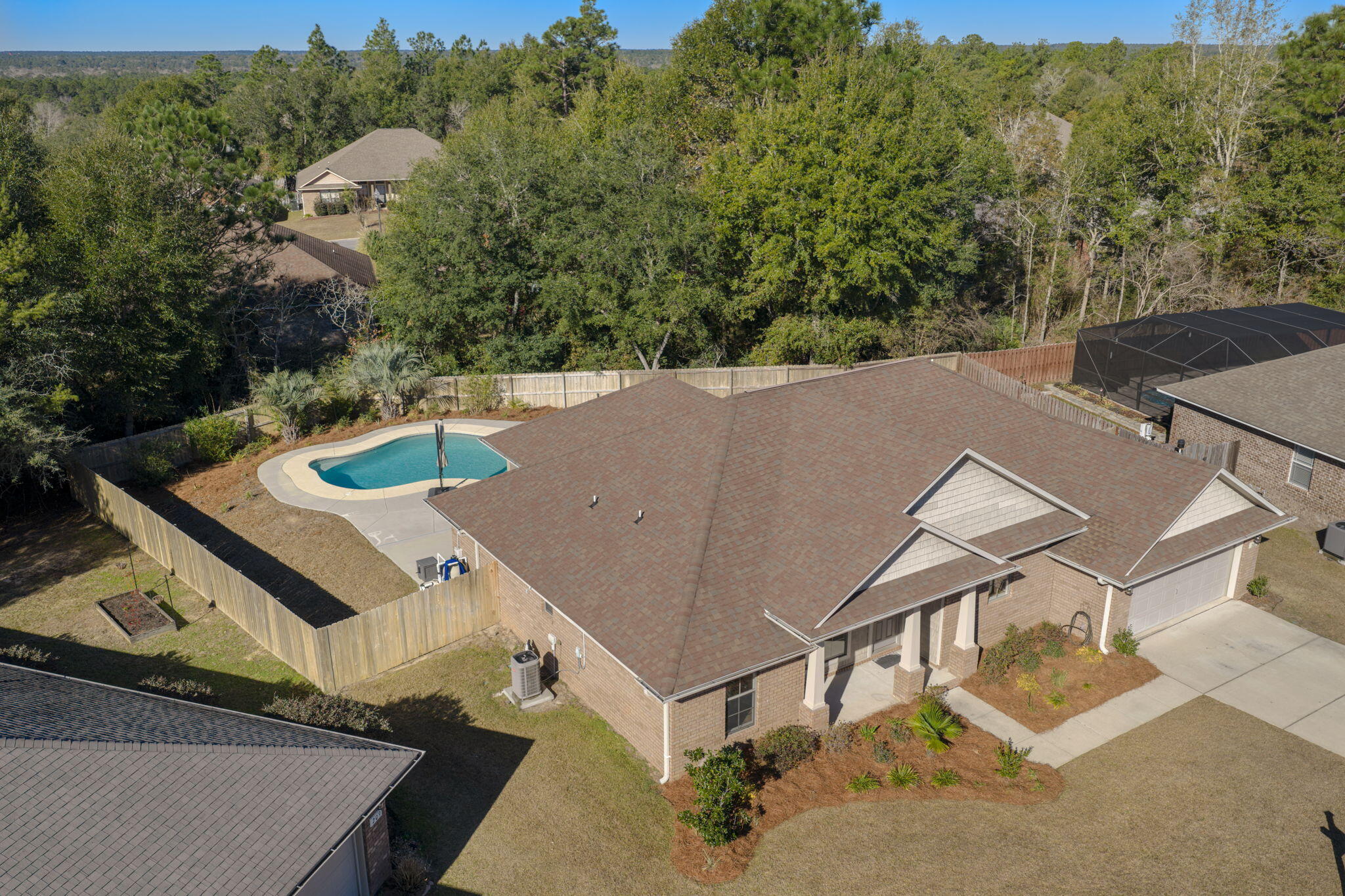 Located on a quiet cul-de-sac, this beautifully updated 3-bedroom home, plus an additional bonus room with a closet, offers exceptional privacy and comfort, featuring a serene, fenced backyard oasis with a stunning in-ground gunite saltwater pool and a tranquil backdrop of mature trees. The open-concept living area flows seamlessly into the kitchen, creating an inviting space ideal for both everyday living and entertaining. The spacious primary suite features a tray ceiling and a large walk-in closet, while the en-suite bath offers a double vanity and an oversized soaking tub for ultimate relaxation. The entire interior has been thoughtfully updated, including new crown molding, all new doors and frames, fresh paint throughout (including closets), new window blinds on every window,