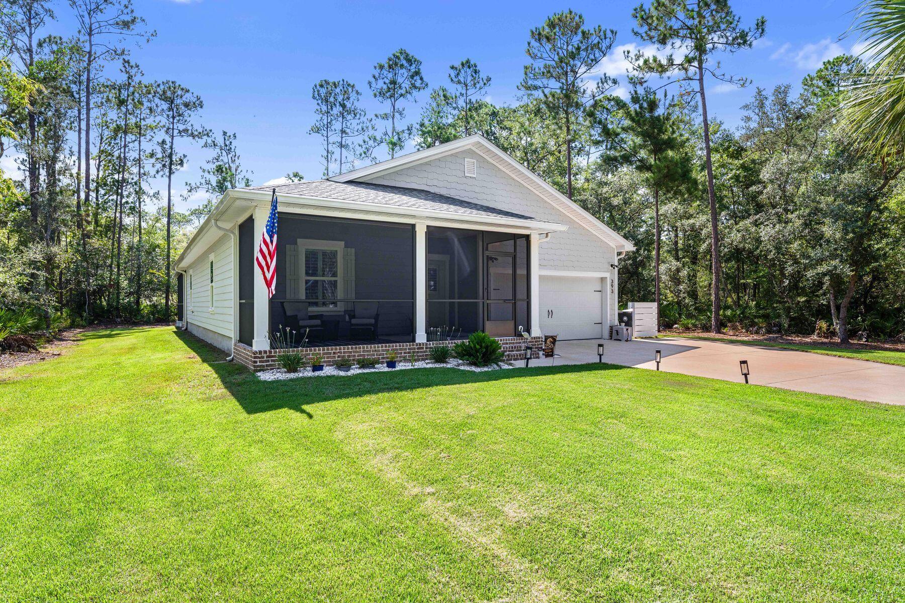 Nestled on a beautifully wooded ½ acre homesite with no HOA, this impeccably maintained home offers the perfect balance of privacy, comfort, and modern living. Surrounded by mature trees and peaceful natural surroundings, you'll enjoy the tranquility of country living while remaining just minutes from the conveniences of Freeport and the Emerald Coast.

Thoughtfully designed with over 1,700 square feet of single level living, this four bedroom home features a desirable split floor plan that offers flexibility for today's lifestyle, including the option to use one of the guest bedrooms as a home office. The open concept living, dining, and kitchen spaces are bright, welcoming, and ideal for both everyday living and entertaining.

Enhancing both style and functionality, the home features plantation shutters throughout, plank flooring, a custom primary closet organization system, and an added linen cabinet in the primary bath. Fresh interior paint complements the light and airy feel, while the screened front porch and expansive screened rear patio with an additional covered area for grilling create exceptional outdoor living spaces designed to be enjoyed year round.

The spacious backyard offers ample room to add a pool, create your own outdoor oasis, or simply relax and enjoy the privacy this oversized homesite provides. Located in the peaceful Cross Creek Shores community, just across from LaGrange Bayou, this move in ready home combines modern finishes, thoughtful upgrades, generous outdoor space, and the freedom of no HOA. Whether you're searching for a primary residence or a second home, this beautifully cared for property is ready to welcome its next owner.