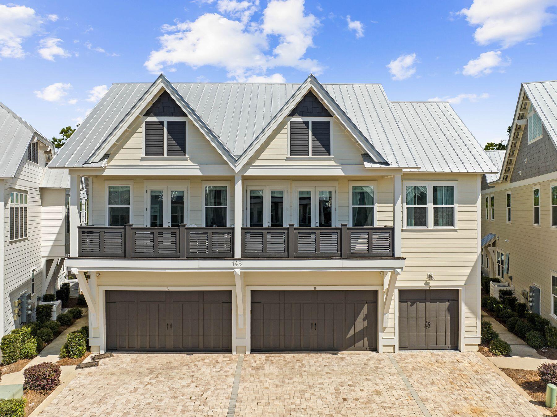 Experience the pinnacle of coastal living in this luxurious, family-friendly townhouse in the tranquil, quieter section of the Prominence community. This beautifully redesigned tri-plex unit blends modern elegance with laid-back beach vibes, offering a perfect retreat just steps from the resort-style amenities and vibrant atmosphere of The Big Chill. Situated less than a mile from the newly renovated Deer Lake beach access, this home ensures convenience and relaxation in one of 30A's most desirable neighborhoods. Inside, the townhouse boasts 10-ft. ceilings, a gourmet kitchen with quartz countertops, farm sinks and Electrolux appliances, including a built-in microwave, stove and dishwasher. The open-concept living space features shiplap accent walls, adding a charming coastal touch to both the living area and master suite. Upgraded hardwood floors and soft-close cabinetry throughout elevate the interior design, while the master bath indulges with a luxurious rain shower head. Perfect for families or investors, this two-bedroom townhouse offers a serene escape with excellent rental potential. The property enjoys a quiet location in the back of the neighborhood, providing a peaceful retreat from the activity of the neighborhood. Prominence itself offers two resort-style pools, a fitness center and easy access to local dining, shopping and entertainment. Whether you're seeking a stylish second home or an investment property this townhouse in Prominence delivers an exceptional blend of luxury, comfort and coastal charm.