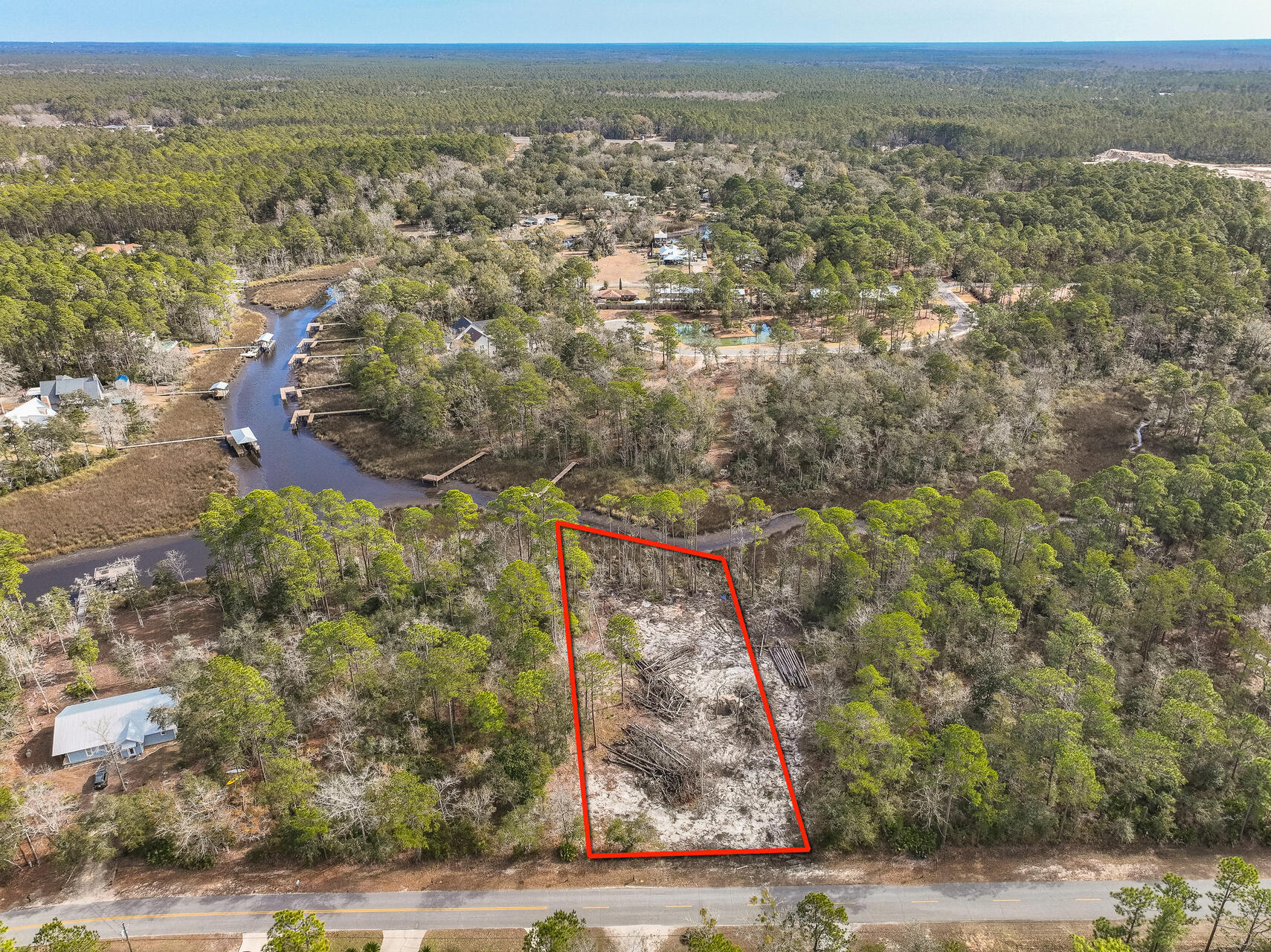 Rare waterfront homesite on Mallet Bayou offering approximately 0.74 acres and more than 90 feet of bay frontage. Framed by mature oaks and pines, the property provides a private, natural setting with direct water access and plenty of room to create a custom residence.

Conveniently located just minutes from U.S. Highway 331 and a county park with a public boat ramp, the property combines peaceful waterfront living with easy access to everyday conveniences. Opportunities to secure a homesite with this amount of frontage and this setting are increasingly limited.