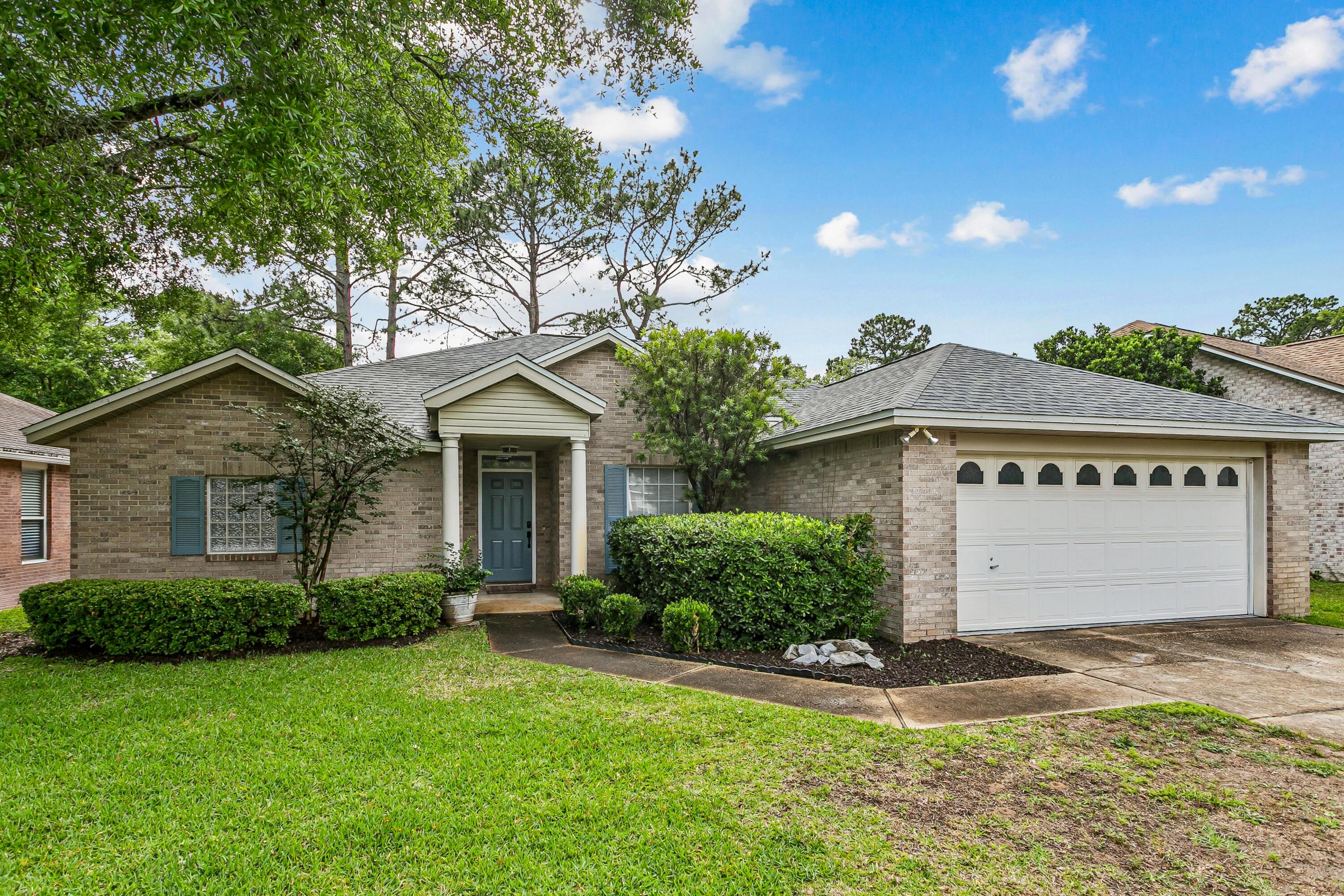The exterior of the home is constructed with durable brick, adding to its curb appeal. This property offers an ideal living environment for those seeking a well-appointed, low-maintenance home on a cul-de-sac in a picturesque lakefront setting.
