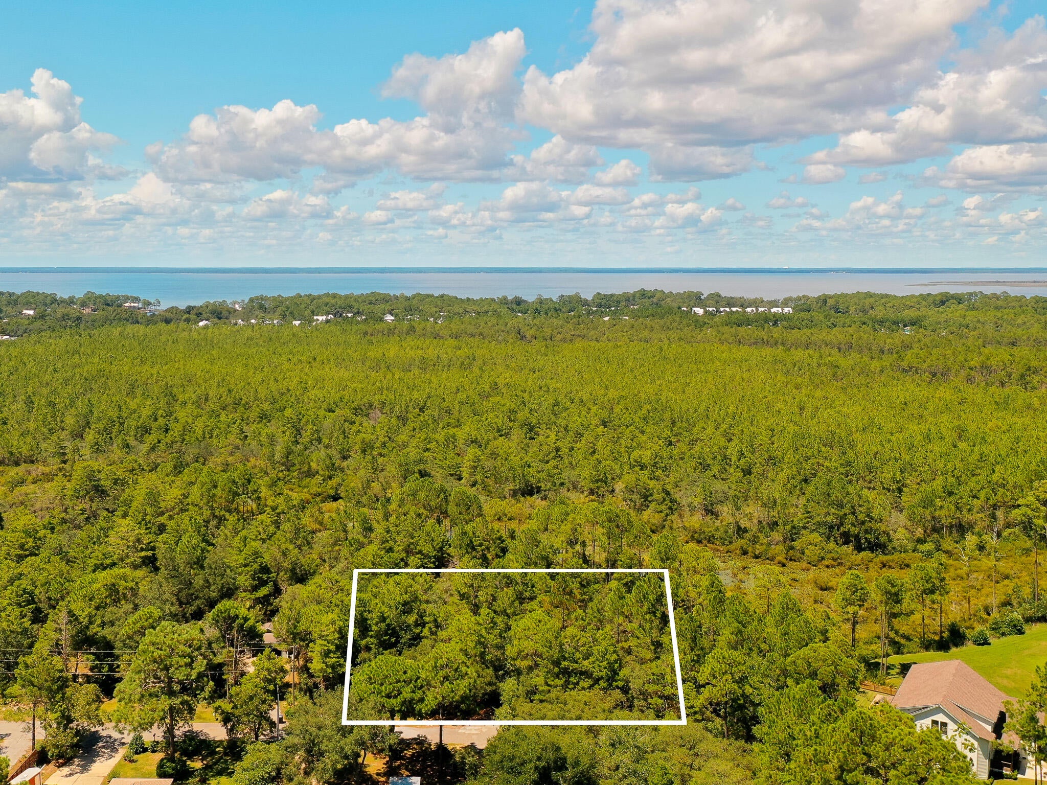 Build your dream home on this spacious 0.53-acre homesite offering privacy, flexibility, and an excellent location! Backing up to the State Forest, this property provides a peaceful natural setting with no homes directly behind you and plenty of room to create the home and outdoor space you've been envisioning.

With no HOA and no build-out time, you have the freedom to build on your own timeline. The generous lot size also provides ample space for boat or RV parking, making it an ideal choice for those looking for a little more room without sacrificing convenience.

Water, sewer, and electricity are available; however, tap fees have not been paid. Conveniently located near Publix, Walmart, Sacred Heart Hospital, shopping, dining, and the beautiful beaches of South Walton, this homesite offers the perfect combination of privacy and accessibility.

Whether you're planning a primary residence, second home, or future investment, opportunities like this are becoming increasingly hard to find. Bring your plans and make this property your own!

Buyer to perform all due diligence and independently verify lot dimensions, utility availability and connection costs, zoning, building requirements, and suitability of the property for the buyer's intended use.