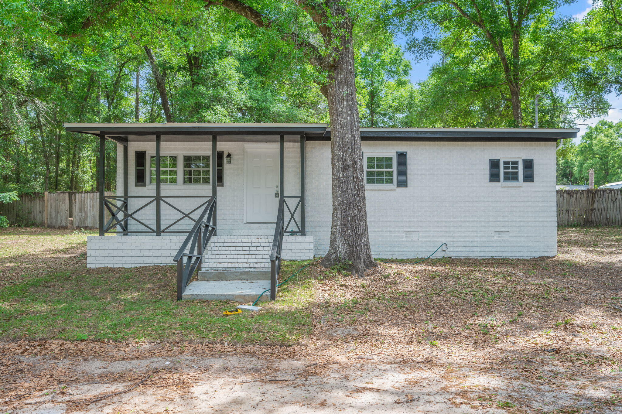 Newly Remodeled!! Just updated to make this home a 3 bedroom! This huge lot offers plenty of space and endless potential--perfect for those looking for room to expand, garden, or simply enjoy extra outdoor space. The property features a 3-bedroom, 1 oversized bathroom layout with a comfortable living room and dedicated dining area. Enjoy relaxing mornings or evenings on the covered front porch, along with an additional covered porch at the back of the home. Conveniently located close to schools, dining, and shopping, this property offers both charm and opportunity in a prime location.