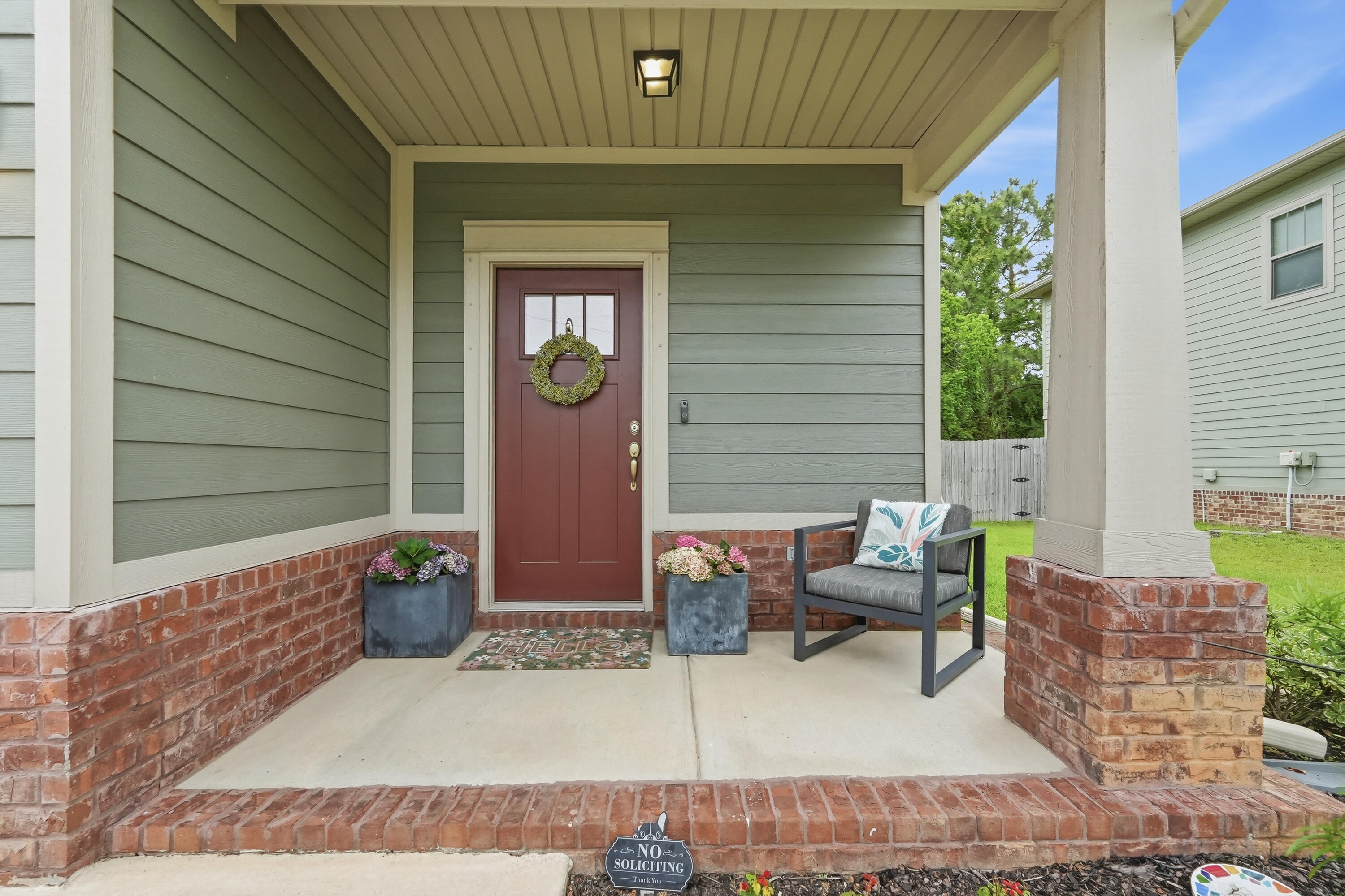 Skip the traffic - Your commute to Hurlburt Field or Ft. Walton Beach is just MINUTES! VA ASSUMABLE loan for qualified buyer! Located in East Navarre, this exceptional MOVE-IN READY home is like-new, just 4 YEARS OLD! Showcasing thoughtful design inside and out, the exterior features HARDI board siding complemented by timeless BRICK accents, an IRRIGATION system, rain GUTTTERS, a fully FENCED BACKYARD for added privacy and a large, covered PATIO. Inside, the home offers BRAND NEW LVP FLOORING throughout the main living areas on the first floor, elegant neutral TILE in the bathrooms, and comfortable carpeting in the bedrooms. Additional features in this open concept plan include a welcoming entryway with TRANSOM accent window, COAT closet, guest HALF-bath, TALL ceilings, WIDE baseboards, CROWN molding, and a dedicated dining area. The beautifully appointed kitchen is complete with STAINLESS steel appliances, TILE backsplash, shaker-style SOFT-CLOSE cabinetry, GRANITE countertops, a WALK-IN pantry and an oversized ISLAND with pendant lights and BREAKFAST BAR seating. This home TRULY has it all!