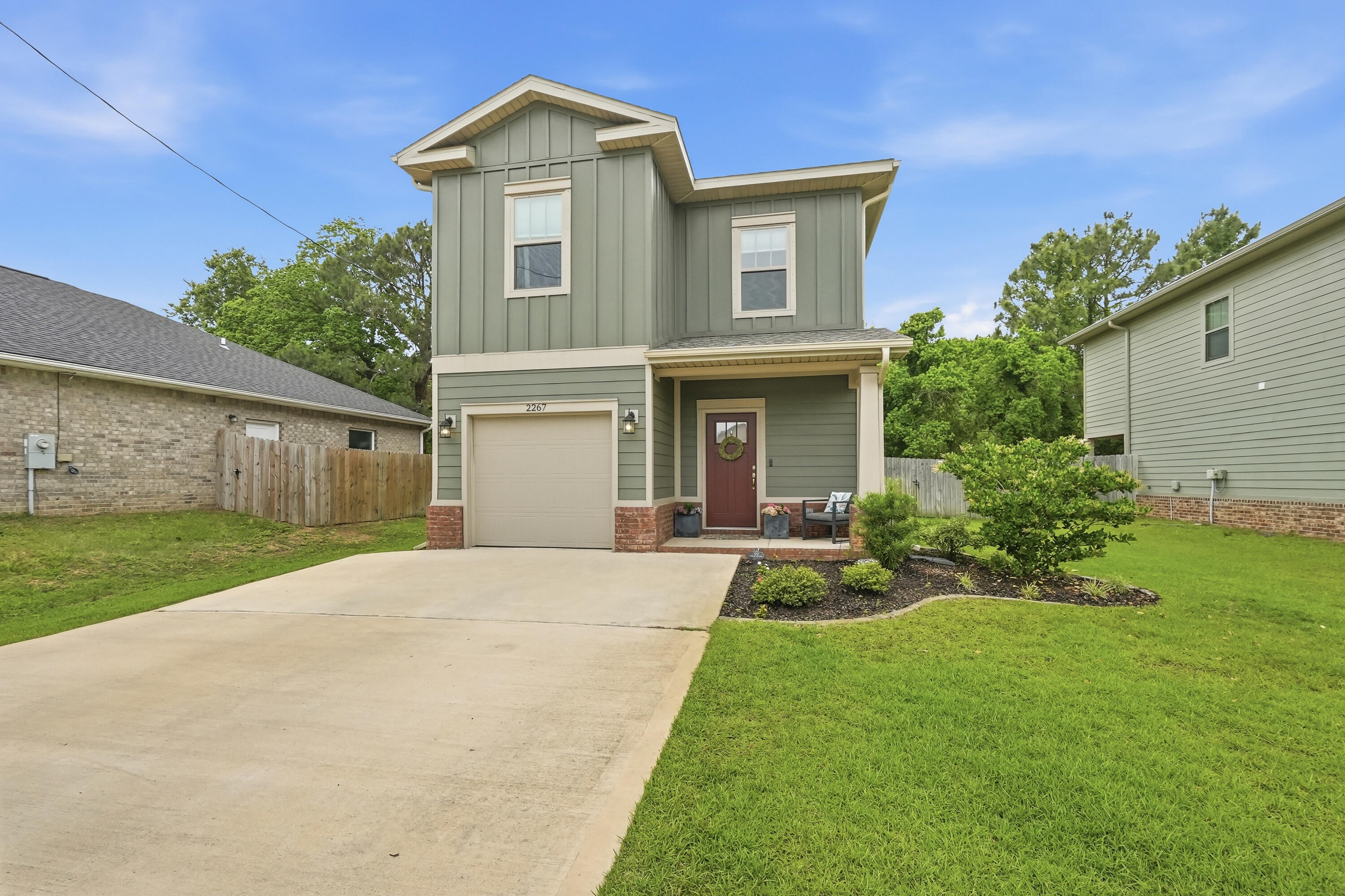 VA ASSUMABLE option for a qualified buyer! This exceptional MOVE-IN READY home is like-new, at just 4 YEARS OLD! Skip the traffic - your commute to Hurlburt Field or Ft. Walton Beach is just MINUTES from this East Navarre location! Showcasing thoughtful design inside and out, the exterior features HARDI board siding complemented by timeless BRICK accents, an IRRIGATION system, rain GUTTTERS, a fully FENCED BACKYARD for added privacy and a large, covered PATIO. Inside, the home offers BRAND NEW LVP FLOORING just installed throughout the main living areas on the first floor, elegant neutral TILE in the bathrooms, and comfortable carpeting in the bedrooms. Additional features in this open concept plan include a welcoming entryway with TRANSOM accent window, COAT closet, guest HALF-bath, TALL ceilings, WIDE baseboards, CROWN molding, and a dedicated dining area. The beautifully appointed kitchen is complete with STAINLESS steel appliances, TILE backsplash, shaker-style SOFT-CLOSE cabinetry, GRANITE countertops, a WALK-IN pantry and an oversized ISLAND with pendant lights and BREAKFAST BAR seating. This home TRULY has it all!