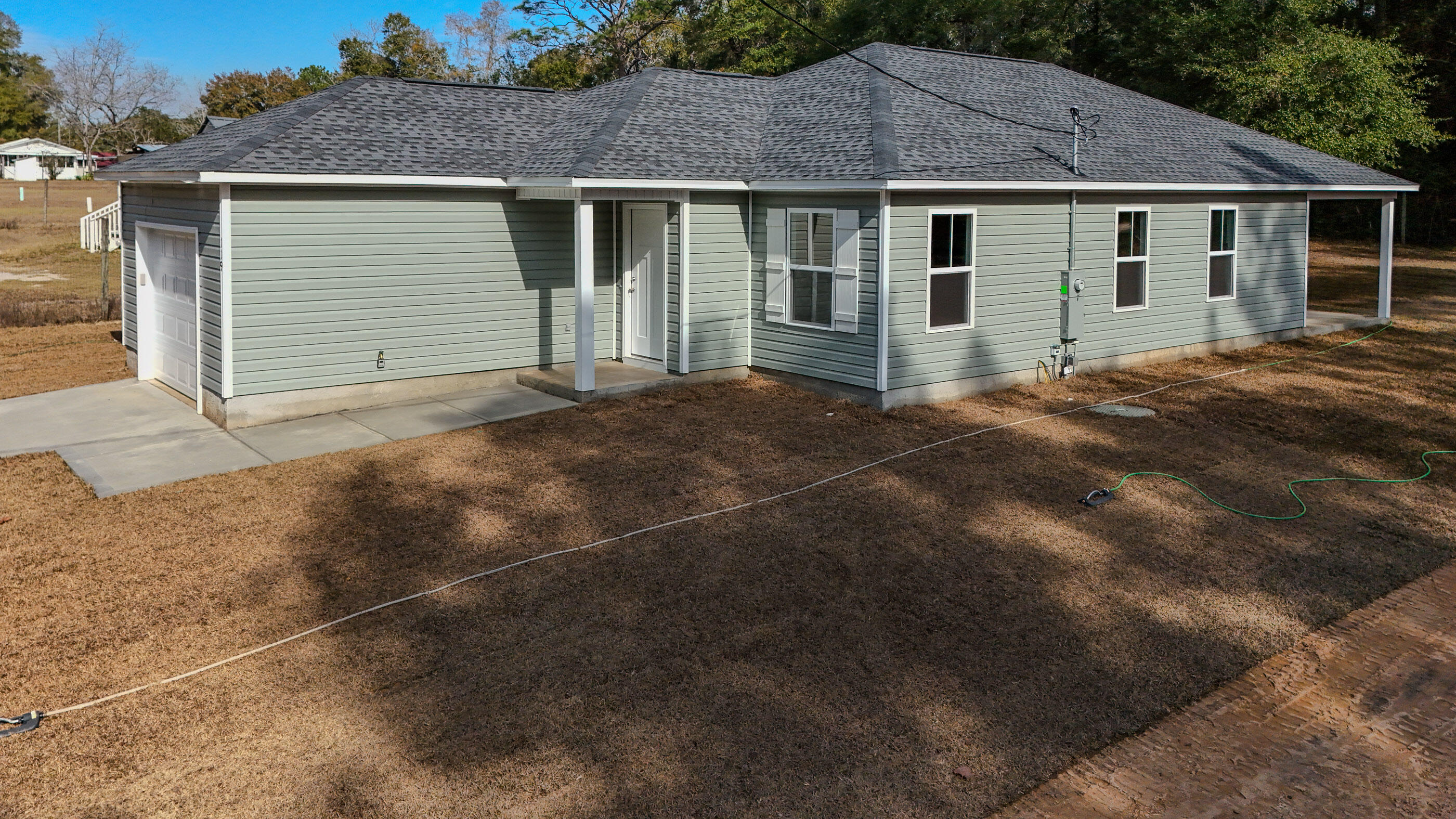 NEW quality construction built by Jacob Locke Construction.  3/2 home offers all the things you are looking for. Level lot located in the city just blocks from beautiful Lake DeFuniak; Home offers the perfect low maintenance living, easy yard upkeep, and low-cost utilities. Home has an open concept with living, dining, and kitchen combo, great pantry, large breakfast bar in kitchen and is perfect for entertaining. This cozy home offers a split floor plan with a great master suite on the rear of the home for your privacy.  All the space has been utilized in this floor plan to maximize its use. Home has a great covered back porch overlooking the backyard. Don't miss this opportunity. Location for commuting is excellent! Builder pays 4% in closing cost.