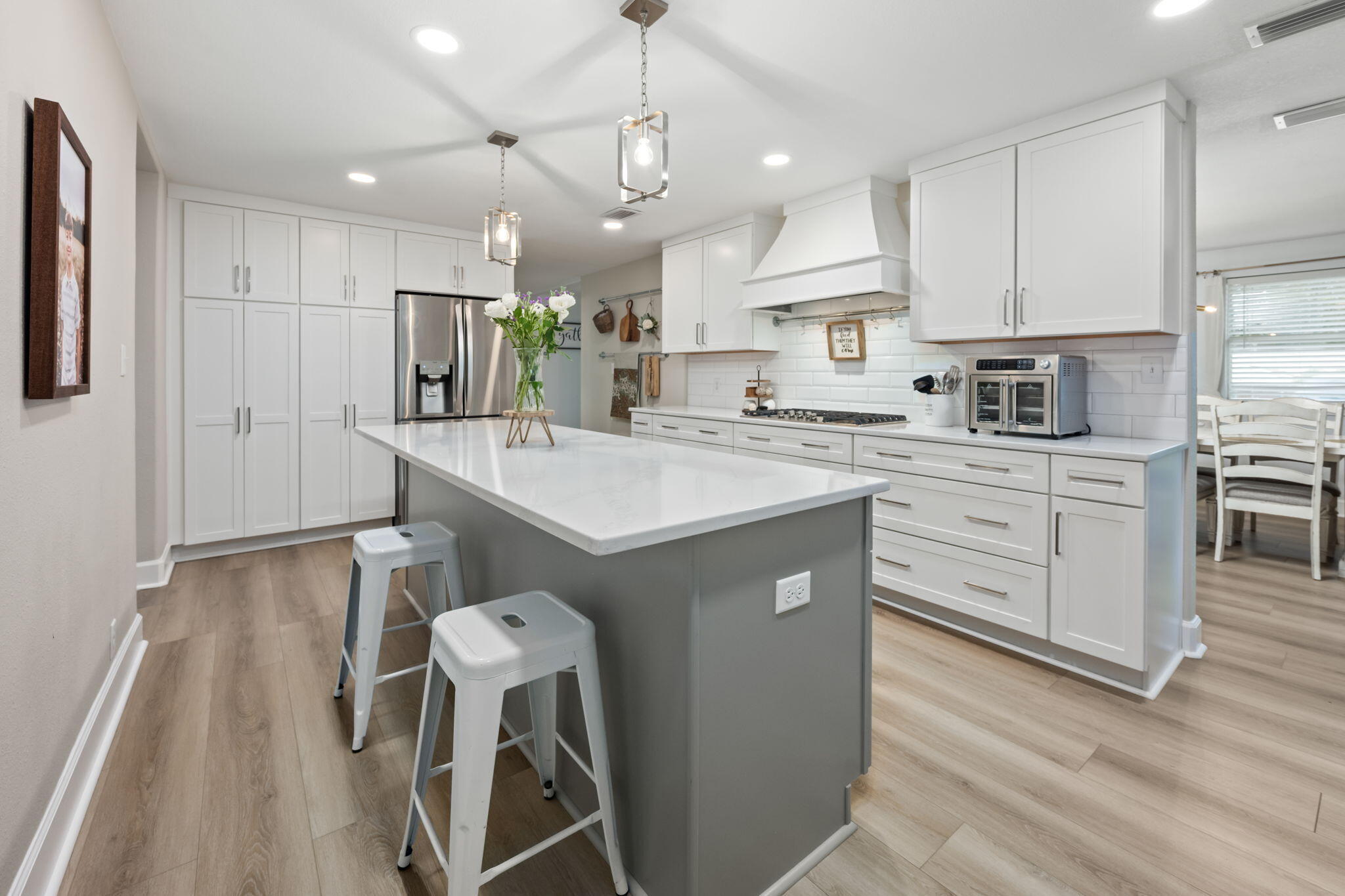 Welcome to 255 Edge Ave in Valparaiso--a beautifully updated 6-bedroom, 3-bath home with a dedicated office, spacious living areas, and room to accommodate a variety of needs. Fully remodeled in 2022 with an additional kitchen renovation in 2025, this home combines modern finishes with an exceptionally functional floor plan. The first-floor primary suite features a large walk-in closet and a spacious private bath with an oversized walk-in tile shower, frameless glass shower door, garden tub, and double vanity. Upstairs, you'll find three generously sized bedrooms that offer an impressive amount of space. Outside, enjoy the covered front porch, rear-entry 2-car garage, and oversized driveway providing abundant parking for multiple vehicles, a boat, or other recreational equipment. All of this is just 0.4 miles from Lincoln Park, where you can swim, fish, picnic, enjoy the playground, launch your boat, or take in Valparaiso's Fourth of July fireworks--and only approximately 1.7 miles from Eglin Air Force Base.

Inside, the updated kitchen serves as the heart of the home and benefits from its 2025 renovation, while the extensive 2022 remodel gives the home a fresh, updated feel throughout. With six bedrooms plus a separate office and three full bathrooms, there is no shortage of flexible space for guests, hobbies, a home gym, media room, or additional workspace.

The covered front porch adds to the home's welcoming curb appeal and provides a comfortable spot to relax outdoors. Around back, the 2-car garage and expansive driveway offer the kind of parking and storage flexibility that can be hard to find.

The location is another standout feature. Lincoln Park is practically around the corner and offers waterfront recreation along Boggy Bayou, including a boat launch, swimming area, fishing, playground, picnic areas, and beautiful waterfront views. Whether you're heading out on the boat, spending an afternoon at the park, or watching the annual Fourth of July fireworks, it's all conveniently close to home.

With its extensive updates, six-bedroom layout, dedicated office, first-floor primary suite, oversized secondary bedrooms, abundant parking, and convenient Valparaiso location near Lincoln Park and Eglin Air Force Base, 255 Edge Ave offers an impressive combination of space, updates, recreation, and accessibility. Schedule your private showing and see everything this home has to offer!