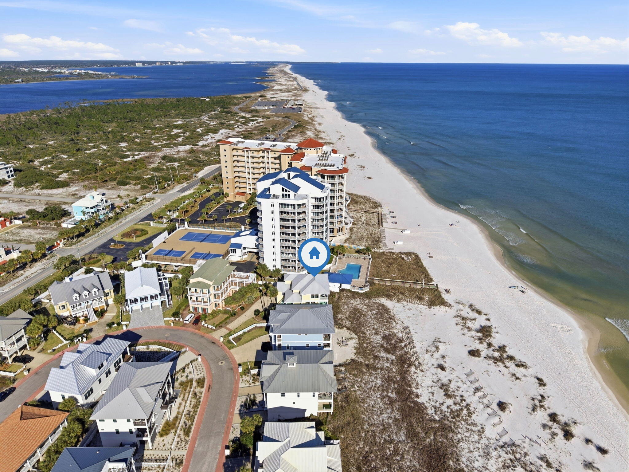 Welcome to 1242 Parasol Place, a Gulf front retreat in the gated Parasol community on Perdido Key where coastal living unfolds at an unhurried pace. Located in a rent-restricted neighborhood with an impressive 900 feet of private beach frontage reserved exclusively for Parasol owners, this residence offers a rare opportunity to enjoy the Gulf without the bustle of vacation rentals. Here, each day begins with the soothing sounds of the Gulf nearby, & evenings close with colorful sunsets stretching across the water. Inside, this 4-bedroom, 4-bath home is thoughtfully designed with beautiful hardwood flooring, tall ceilings, & abundant natural light that creates a welcoming atmosphere throughout the open-concept living spaces. The kitchen serves as the heart of the home, featuring granite cou