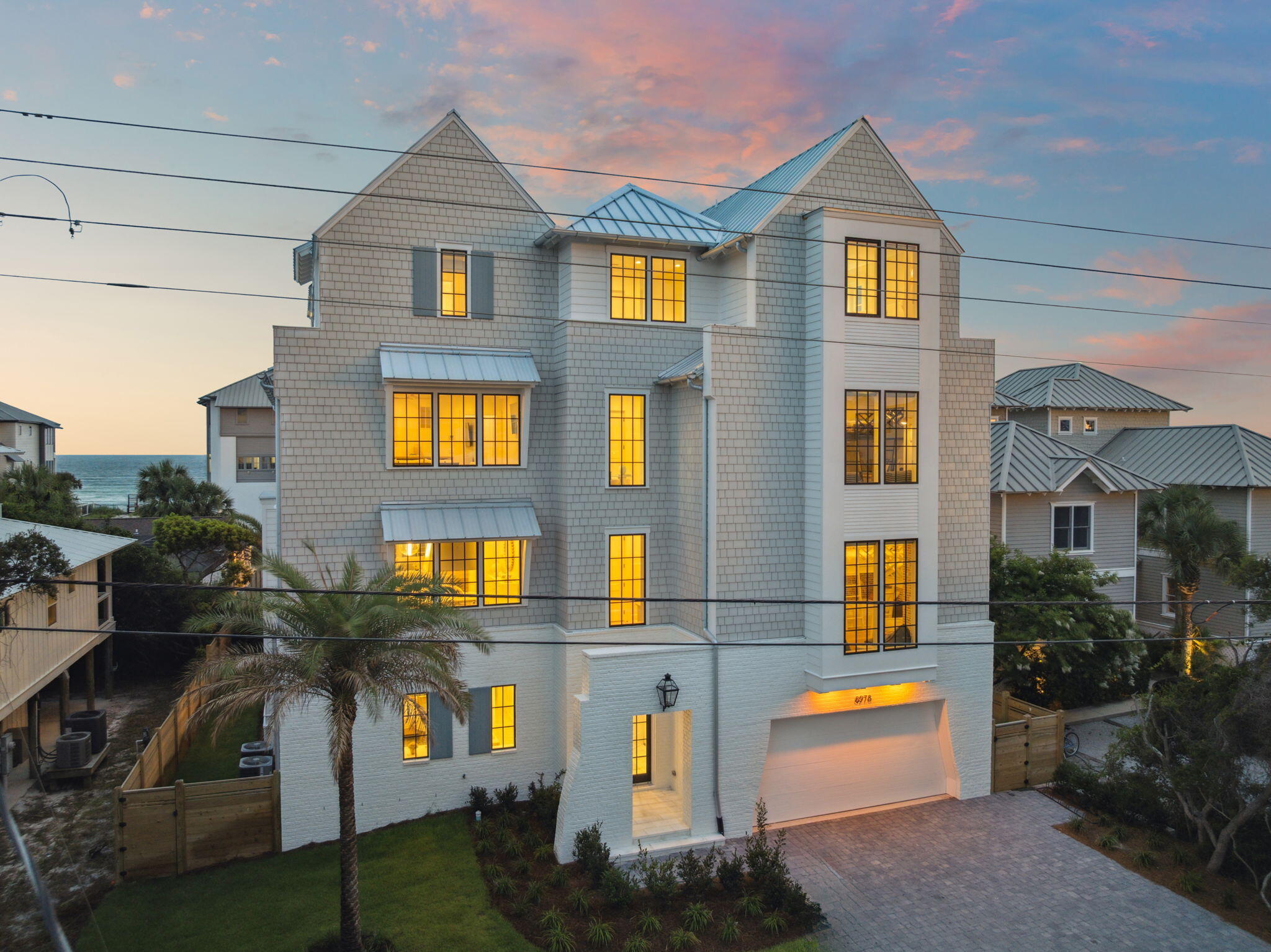 Introducing 8978 E County Highway 30A -- a remarkable Gulf-view beach home offering 7000+ sq ft of thoughtfully designed interior space and 1,800+ sq ft of outdoor living. Features include 9 bedrooms, 7 full baths, 2 half baths, expansive covered terraces with Gulf views, and a chef's kitchen with premium appliances and an oversized island. Modern, timeless finishes throughout. The first floor features a spacious recreation room that opens to a covered patio, pool, and built-in grill, offering a private setting for leisure and entertainment. On the second floor, the main living area is bathed in natural light and oriented to take full advantage of surrounding views.

The third floor offers a bunk room, additional living area, and guest bedrooms each with a private porch or balcony and Gulf-facing views. Upstairs, the fourth floor includes a quiet landing with a built-in daybed and a luxurious primary suite featuring a private balcony, walk-in closet, and spa-inspired bathroom with soaking tub and glass-enclosed shower.

Additional highlights include two laundry rooms and an elevator for added convenience. This property is well-suited as a full-time residence, vacation getaway, or rental investment, offering versatility and space in a sought-after 30A location.

Located within convenient reach of dining, shopping, and recreation along 30A.

*** All information and dimensions to be verified by buyer.