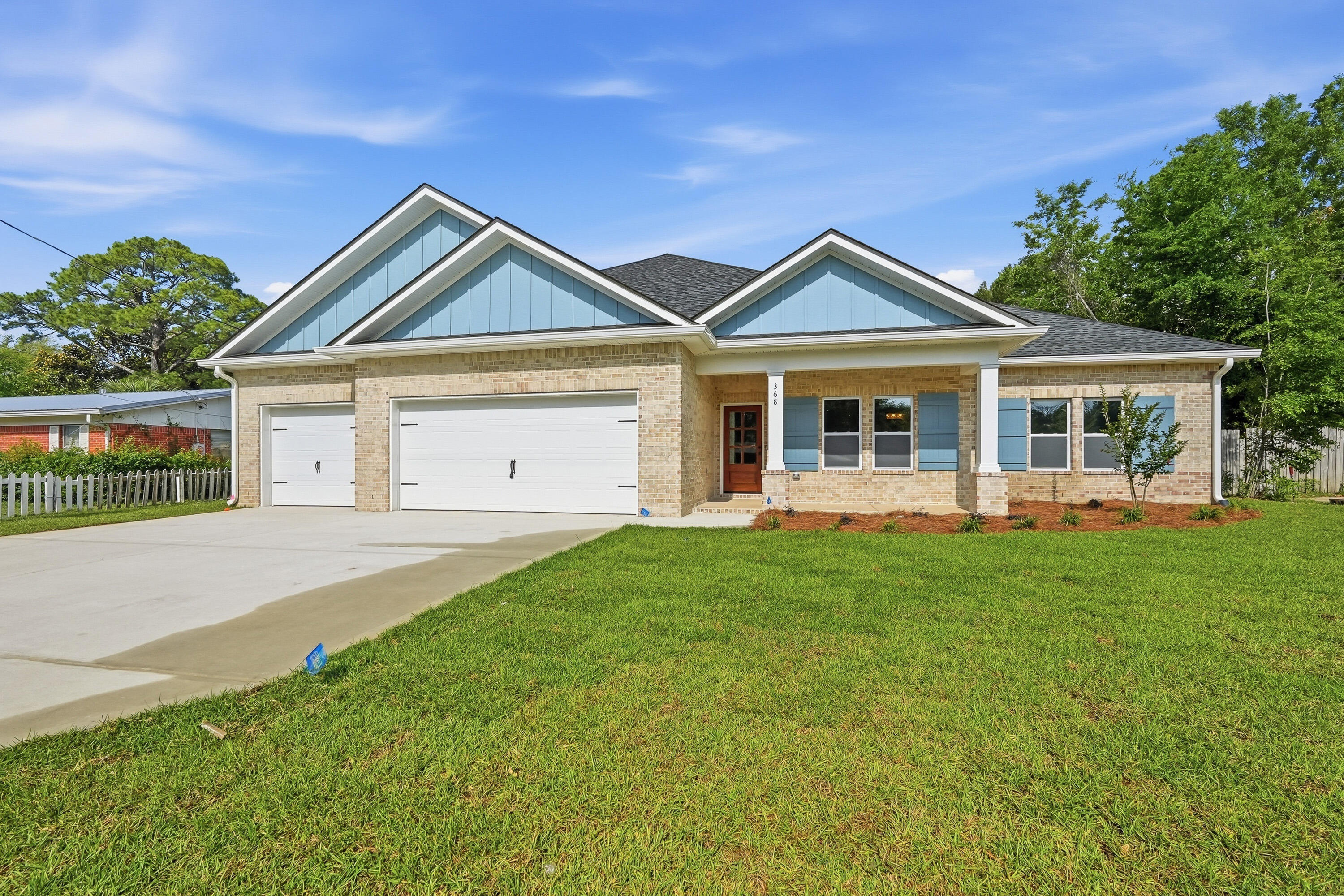 Custom quality meets coastal convenience in this stunning new construction home by local favorite Grand American Homes. Situated on a spacious .26-acre oversized lot in an established neighborhood, this all-brick, one-story residence is designed with a high-end feel that far exceeds standard builder grade. The interior showcases premium finishes including quartz countertops throughout, soft-close cabinetry, and durable LVP flooring with no carpet. The gourmet kitchen is a chef's highlight, featuring a custom backsplash, ample storage, and a gas appliance package with a gas range and side by side fridge. The split floor plan offers 4 bedrooms and 3 full baths: a spacious primary suite with a walk-in closet, tiled shower, and soaking tub; two bedrooms sharing a bathroom; and a 4th bedroom with a private en-suite bath. Enjoy the covered front or back porches. Peace of Mind: Includes a 1-year builder warranty, 10-year structural warranty, and a 1-year termite bond.