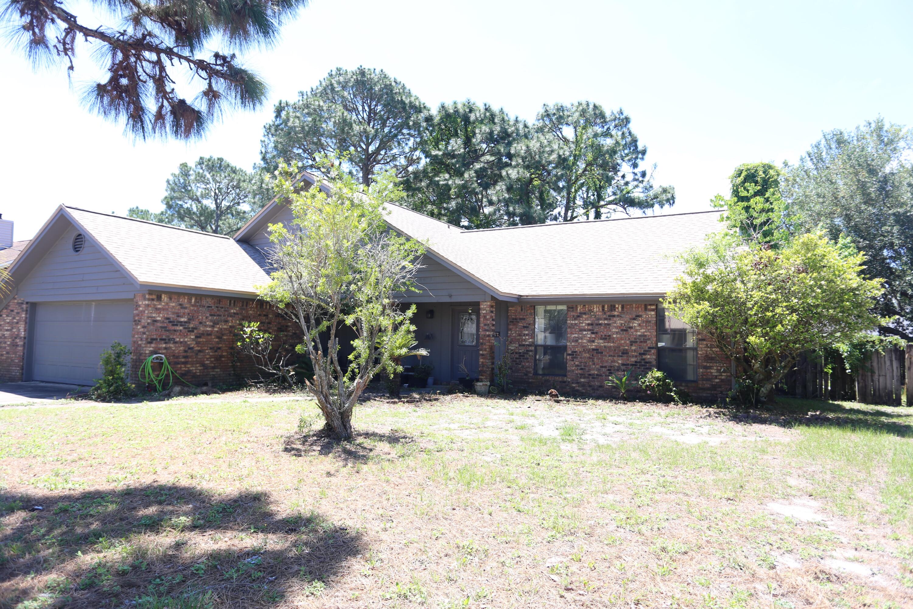 The potential in this property is endless! Unlock this ''as is'' property, perfect for investors, flippers, or buyers willing to take the time to make this their dream home.  This fixer-upper offers solid bones, a great layout, large rooms, (buyers to verify all footage), and an extremely large and desirable lot. The location is a well sought after neighborhood close to base and near it all! 

A spacious floor plan with four large bedrooms, two are masters, one down and one up, offers a great layout for a family and plenty of room for customization. Whether you are looking to renovate and resell or build more equity quickly, this is an opportunity you won't want to miss as it is priced well below value.

Roof was done in 2022 and the AC 3 Ton Carrier 2019