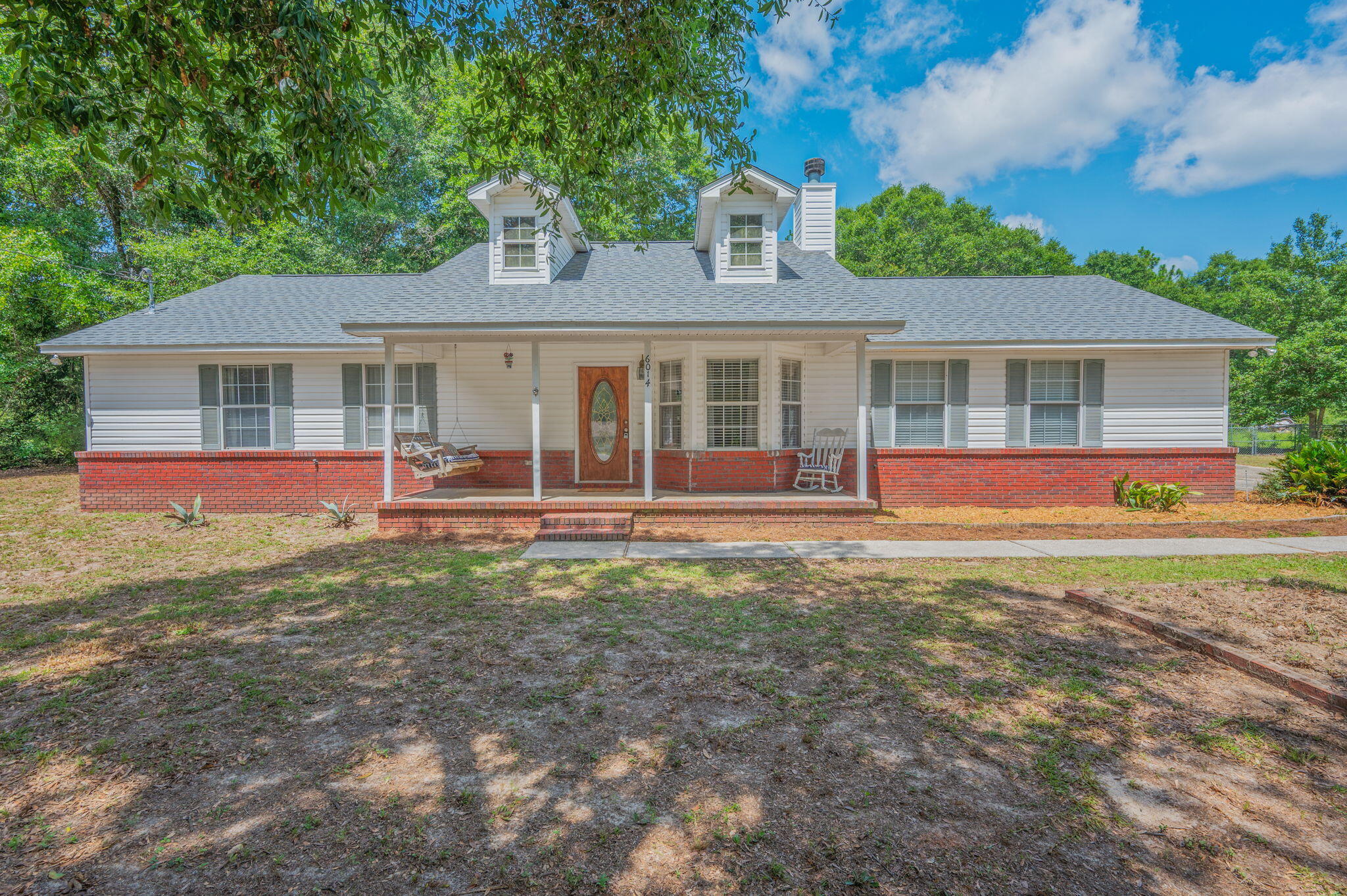 Here is your perfect opportunity to own a well maintained home located on a dead end road with no through traffic, residing on over an Acre of land. Sitting back off the  paved road with a long driveway has great curb appeal, you'll find a beautiful front porch ready for your morning coffee or evenings in your swing or rocking chair. Inside a you'll enjoy a large family room with vaulted ceiling and wood burning fire place. Well designed Kitchen and dining area with a breakfast bar. Primary suite and bath are ample sized, as well as the other two bedroom and full bath.  The home has a wonderful screened back porch with cabinets and sink. Did I mention over a full acre of land! Huge backyard with chain link fencing, double gate for access to store you boat, RV or anything else. Plenty of storage with a 12x24 utility building as well as another smaller building. Home also has an oversized side entry garage. This one won't last long, make your appointment today to view opportunities of this wonderful home.
