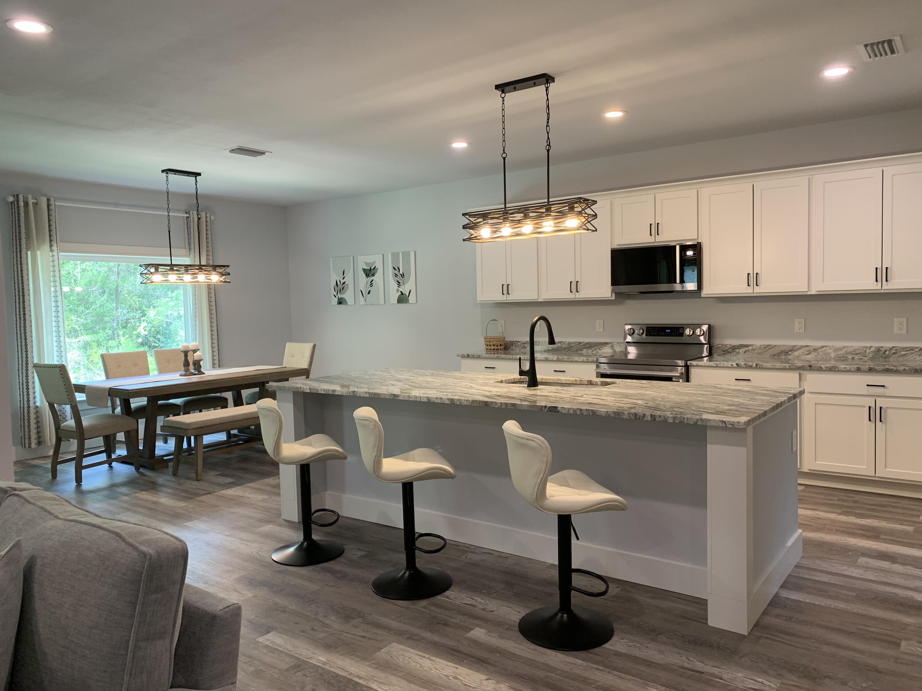This newly built 3-bedroom, 2-bathroom home offers modern comfort, style, and convenience in the heart of Freeport. The spacious open-concept floor plan features a large kitchen with stainless steel appliances, walk-in pantry, granite countertops, and abundant cabinet and counter space, making it ideal for entertaining and everyday living.

The home showcases attractive and durable LVL flooring throughout the main living areas, with tile flooring in both bathrooms for added style and easy maintenance. The primary suite provides a private retreat, while two additional bedrooms offer flexibility for family, guests, or a home office.

Being sold furnished, this turnkey property is perfect as a primary residence, vacation home, or investment opportunity. Conveniently located near shopping, dining, schools, and just a short drive from the beautiful beaches and outdoor recreation of Florida's Emerald Coast.

Buyer to verify all measurements.