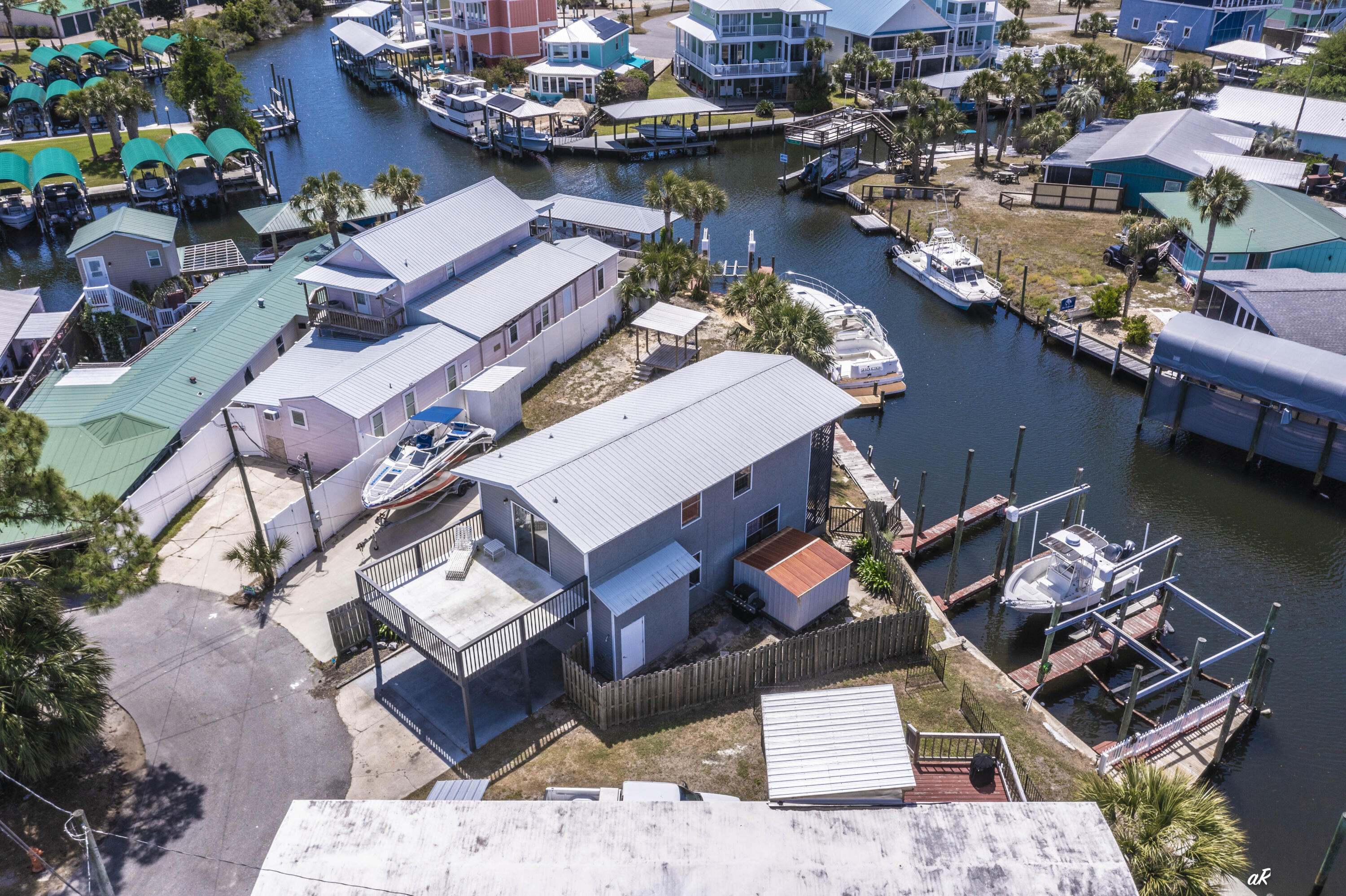 Welcome to 929 Marina Drive! Waterfront like this is a boaters dream and hard to find on Panama City Beach. Located at 929 Marina Drive, this 3-bedroom property sits on deep water with two private boat slips, giving you direct, reliable access whenever you want to be on the water. Whether it's early morning fishing runs, sunset cruises, or pulling up after a day at Shell Island, this is built for true boat living--not just the idea of it. The home offers waterfront balcony views and room to expand, making it flexible for a primary residence, second home, or a high-performing short-term rental. That's where this one separates itself--short-term rentals are allowed, and very few properties offer private boat slips with that flexibility, a combination that drives strong demand and premium rental potential. You're also positioned exactly where you want to be, about 15 minutes to Pier Park for dining, shopping, and nightlife, around 10 minutes to Schooners and St. Andrews State Park for some of the best beach days on the Gulf, and with quick access into Panama City for everyday convenience. There's also a marina just one minute away with a boat ramp, making launching, storing, or hosting guests with boats simple. This is the kind of property buyers wait on--secure your boat, enjoy true waterfront living, and generate income when you're not using it.