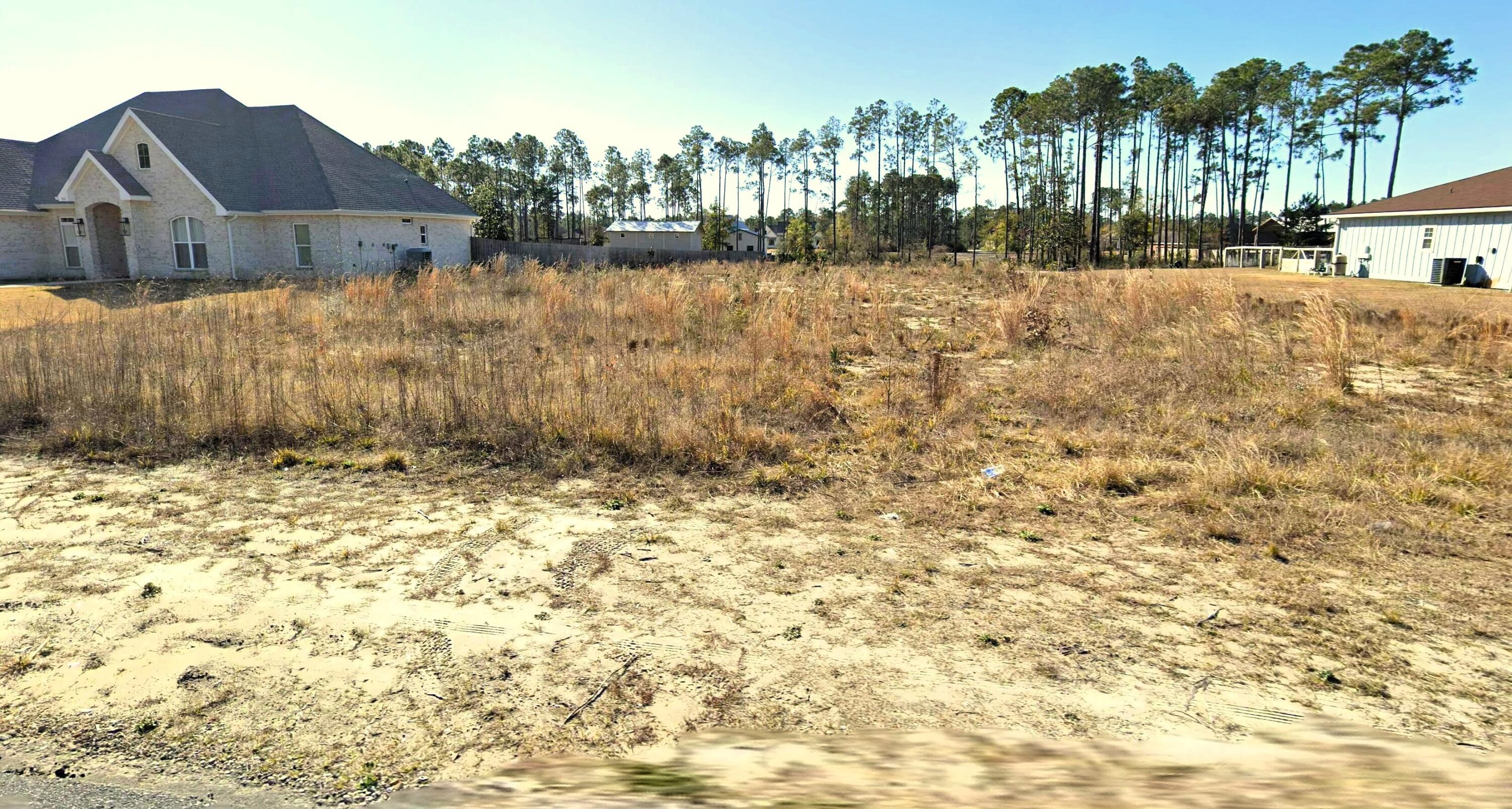 Great homesite building lot.  Nicer homes and off the heavy traffic flow of the busy beach and city, yet so close.  Be beachside or in Panama City town in minutes.  This lot is cleared and ready for next steps, not in a flood zone so no red tape, just submit the building permit for ease of access.  NO HOA is sweet with today's HOA overreach crave, you will avoid it and enjoy your peaceful home site. Easy access to town, airport, beaches, interstate, TAFB, the best of the open spaces with the ease of access for the busy lifestyle.