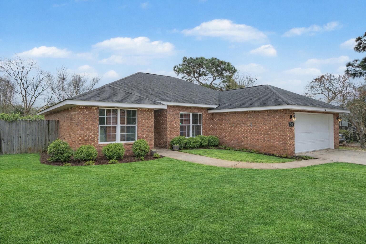 Located just across the county line past Hurlburt Field, this inviting 4-bedroom, 2-bath home offers a spacious open-concept layout designed for comfortable everyday living and effortless entertaining. The versatile fourth bedroom easily adapts to your needs as a guest room, private office, or flex space. Inside, rich hardwood floors flow throughout the main living areas, while vaulted ceilings create a bright, airy atmosphere. Dark wood plantation shutters add a touch of timeless elegance along with enhanced privacy.
The heart of the home features a large breakfast bar that seamlessly connects to the dining area and expansive family room--perfect for gathering with friends and family. A standout feature is the oversized movie screen built directly into the great room wall, creating an  ideal setting for movie nights or game-day viewing.
Step outside and discover inviting outdoor spaces that extend your living area even further--perfect for relaxing evenings, weekend barbecues, or simply enjoying the Florida sunshine. Whether entertaining or unwinding, the outdoor setting offers both comfort and versatility.
Adding to the home's appeal, a nearby shopping center with a brand-new grocery store is within walking distance, making daily errands convenient and stress-free. With its thoughtful layout, stylish finishes, and exceptional indoor and outdoor living, this home is a must-see opportunity.

* Lawn pump and sprinkler system as is*