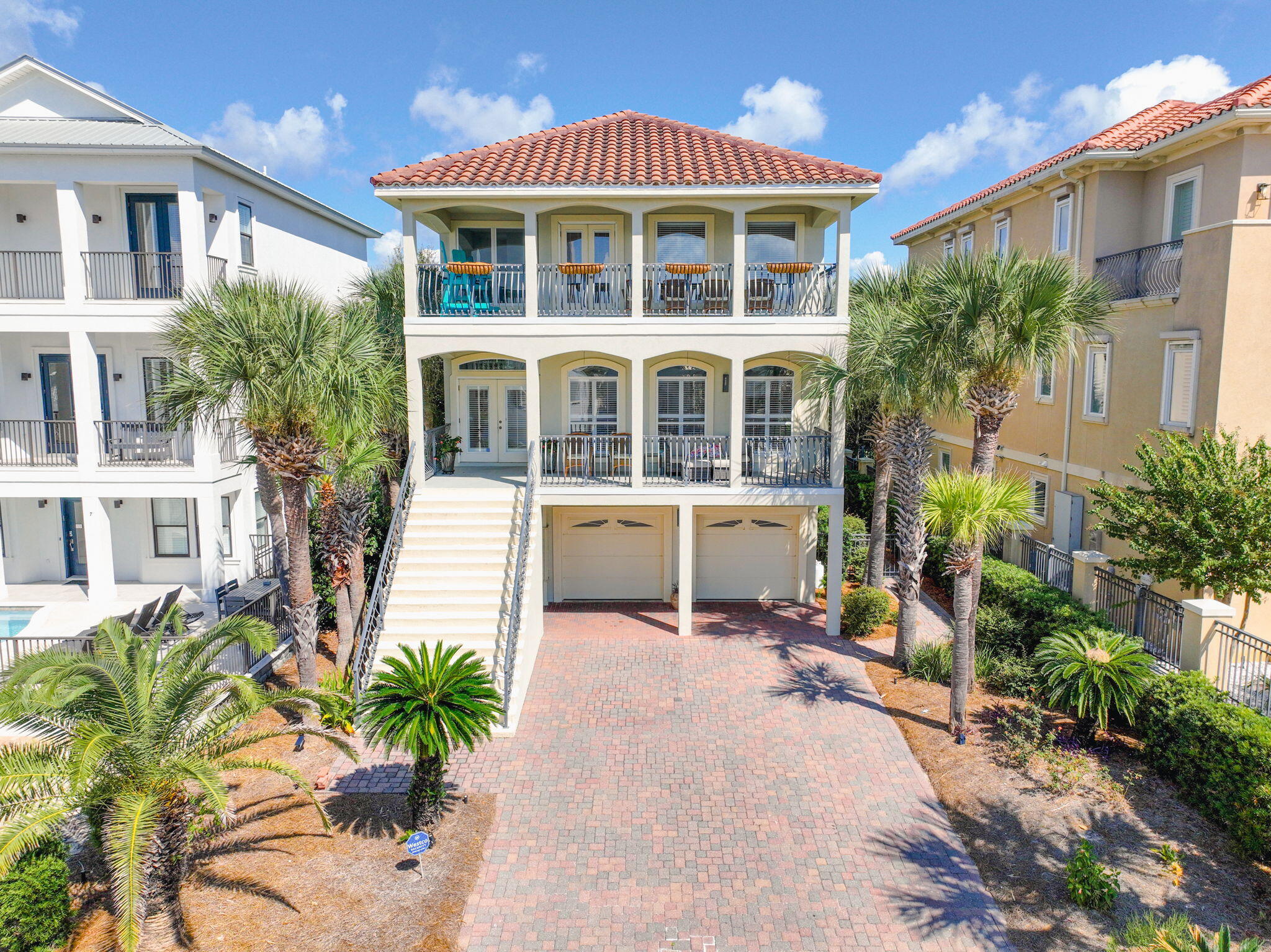 Welcome to 17 Sandy Dunes Circle, a beautifully designed three-story coastal retreat located just half a mile from the sugar-white sands of Miramar Beach. This spacious 4-bedroom, 3.5-bathroom home offers the perfect blend of comfort, style, and proximity to the beach -- ideal for full-time living, a vacation getaway, or a lucrative rental investment.

Step inside to discover a light-filled interior with thoughtful finishes and an open-concept layout perfect for entertaining. The main living area is bright and inviting, while the well-appointed kitchen features ample cabinetry and modern appliances, to include New hot water heater.

Enjoy the sea breeze from any of the three private balconies, offering serene spaces for morning coffee or sunset cocktails. Virtual staging