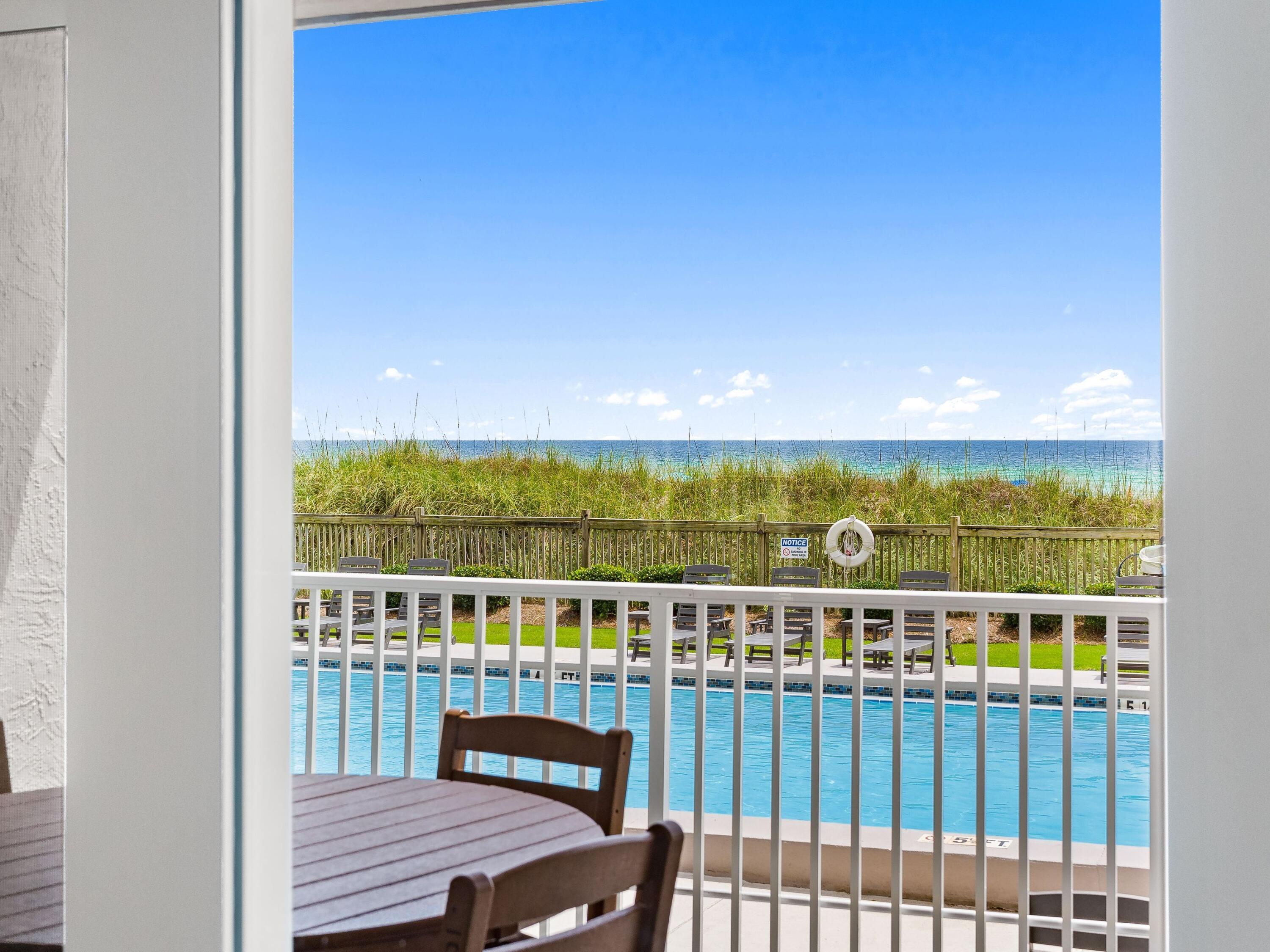 There is something to be said for a beach condo that makes life easier. Positioned on the ground floor of Mariner West, this gulf-front residence offers the rare convenience of stepping from your front door to the pool, beach and community amenities without ever waiting on an elevator. Framed by views of the gulf and the natural sand dunes beyond, it delivers the effortless coastal lifestyle buyers are searching for along the quiet eastern end of Panama City Beach.

Inside, the thoughtfully designed floor plan lives larger than expected, featuring a spacious bedroom, two full bathrooms and an open-concept living area that flows seamlessly to a covered gulf-front patio. Tile flooring throughout creates a clean, low-maintenance environment, while quartz countertops, a fully equipped kitchen and updated bathrooms add style and functionality. The generous living room offers plenty of seating for family and guests, creating a comfortable setting for everyday living or vacation stays.

This residence has also proven itself as an exceptional investment opportunity. Self-managed and not currently listed on Airbnb or VRBO, the property generated approximately $32,400 in gross revenue during 2025, with more than $21,600 already on the books for 2026. The combination of strong rental performance, direct beach access and ground-floor convenience makes it particularly appealing to both investors and second-home buyers. Mariner West offers an impressive collection of amenities, including a beachfront pool, tennis and pickleball courts, shuffleboard, a pool table, gas grilling stations, and outdoor gathering areas overlooking the pool deck. Located along Thomas Drive, the community provides convenient access to local restaurants, shopping, marinas, golf, family attractions and some of the area's most popular waterfront destinations.

Whether you're searching for a personal beach retreat, a seasonal getaway or an income-producing investment, this gulf-front residence combines comfort, convenience and proven performance in one of Panama City Beach's most established beachfront communities.