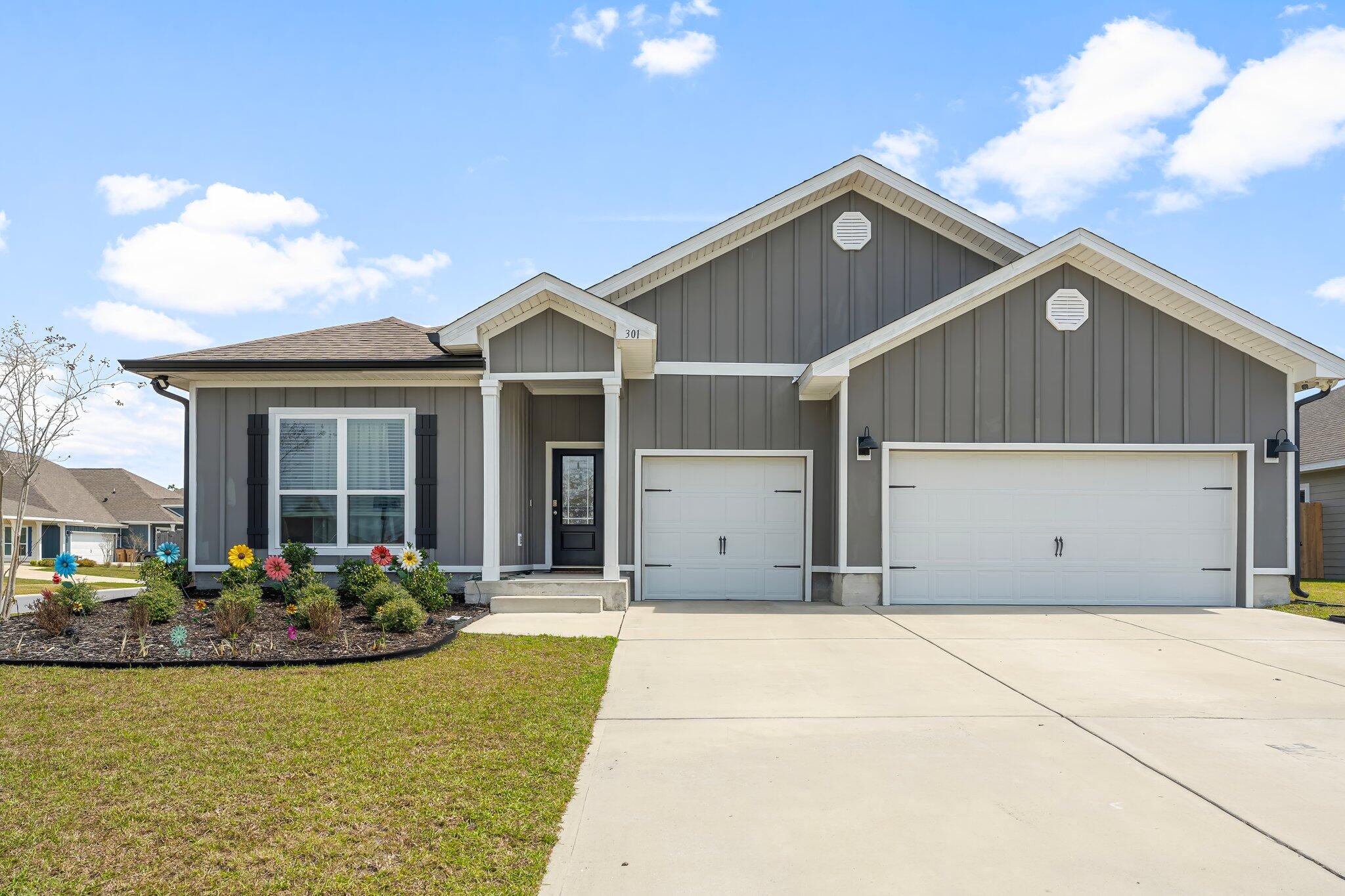 Like-new Camden model with a 3-car garage in sought after Bridge Harbor, conveniently located near Tyndall AFB. Homes with this much space, flexibility, and level of upgrades are hard to find. Enjoy LVP flooring, 9-foot ceilings, elegant trey ceilings, and an open-concept layout designed for everyday living and entertaining. The kitchen features a large center island, granite countertops, and a spacious breakfast nook. The flexible floor plan includes a Jack and Jill bath, guest half bath, and an additional bedroom with its own ensuite and flex space perfect for guests, an office, second living area, or multigenerational living. Smart-home features include keyless entry, video doorbell, automated lighting, smart controls, security cameras, and motion lighting. The corner lot offers a screened-in porch with doggie door, large, fenced backyard, double gate access, sprinkler system, and gutters. Additional upgrades include laundry room cabinets and sink, ceiling fans throughout, and garage shelving. If you want a home that feels like new without waiting for the upgrades, this one deserves a look!