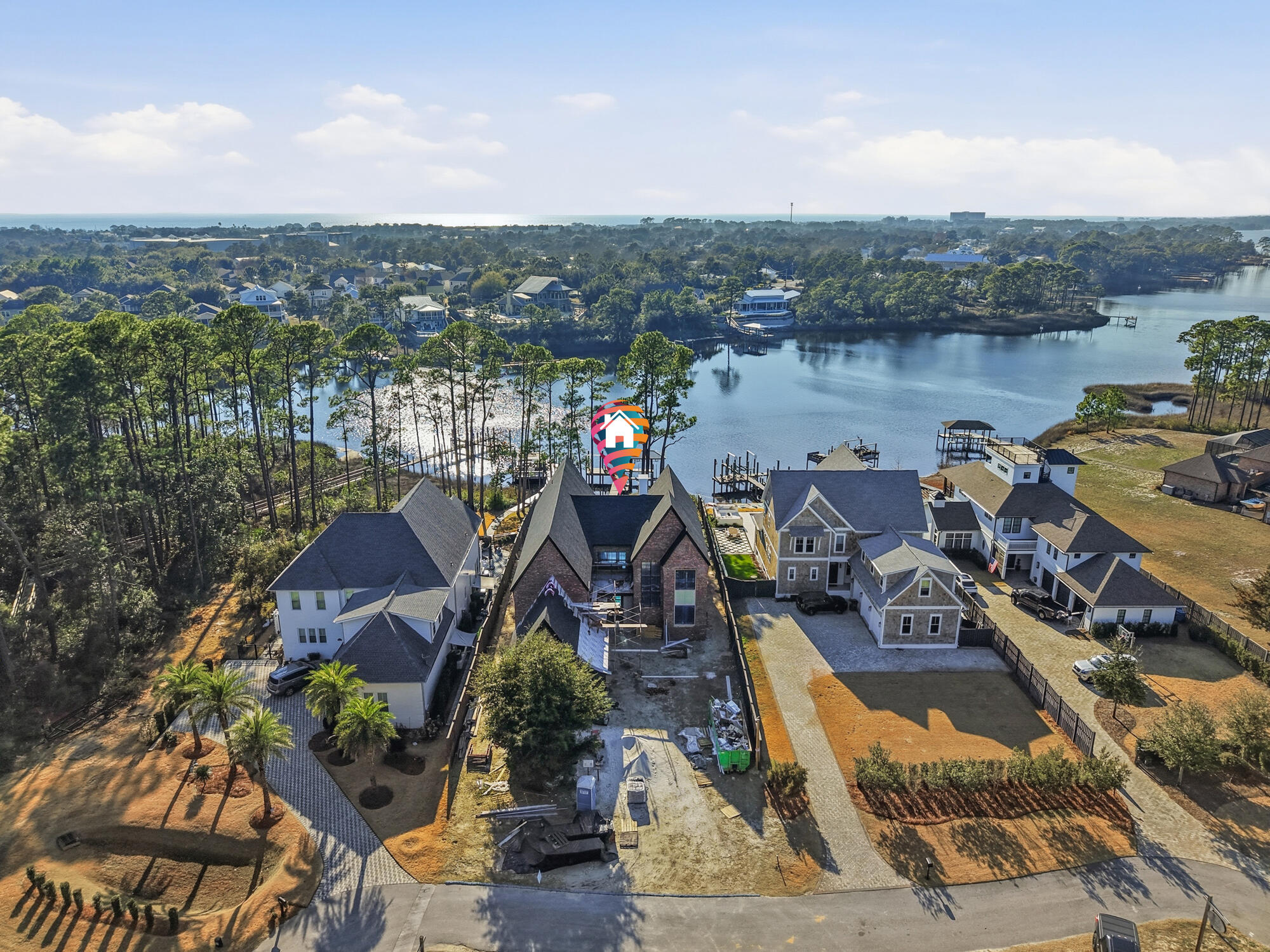 Commanding breathtaking views of Lake Powell, 713 Wild Heron Way presents a rare opportunity to bring a custom vision to life within one of Panama City Beach's most naturally striking settings. Designed with scale, presence, and lifestyle in mind, this waterfront residence offers four bedrooms, five and a half baths, a dedicated playroom or fifth bedroom, and a thoughtfully designed bunk room--creating a home equally suited for everyday living and memorable gatherings.

The great room anchors the home with soaring ceilings and expansive proportions, framing the water beyond and setting the stage for refined coastal living. Upstairs, two bedrooms open to private balconies overlooking the lake, offering ever-changing views and a sense of calm that carries throughout the home. Outdoors, the property is designed for life on the water. A private pool with spa creates a resort-style backdrop, while the boat dock with lift offers direct access to the lake for mornings on the water and evenings returning home by boat. A three-car garage provides ample storage for vehicles and recreational equipment, supporting an active coastal lifestyle.

Offered "As Is" as an opportunity to complete and personalize, this residence invites its next chapter where finishes, details, and design selections can reflect a truly bespoke vision. With its exceptional setting, thoughtful layout, and waterfront orientation, 713 Wild Heron Way stands as a compelling canvas for creating a dream home defined by elegance, intention, and a powerful sense of place.