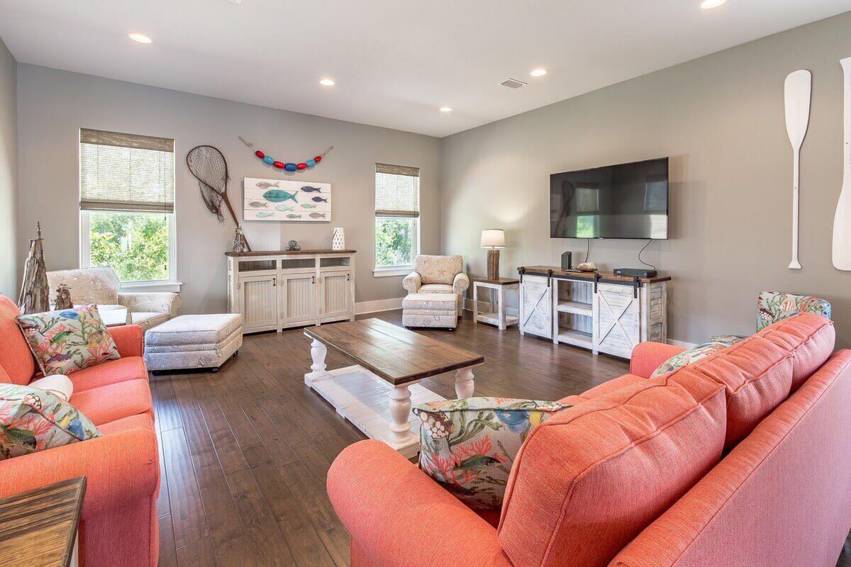 Under $1 million in Frangista Beach, this spacious coastal retreat offers an exceptional combination of size, location, and rental potential. Sold furnished and rental-ready, the home accommodates up to 16 guests and has been refreshed with a new air-conditioning system, fresh interior paint, and new engineered wood flooring throughout.
The bright, open-concept living area features abundant natural light, generous seating, and a large dining space ideal for gathering with family and friends. The adjoining kitchen offers white cabinetry, granite countertops, stainless steel appliances, a spacious island, and additional bar seating. Thoughtfully planned sleeping accommodations include well-appointed bedroom suites, a twin guest room, and a custom built-in bunk room that adds character and valuable guest capacity. Multiple bathrooms feature granite vanities, tiled showers, and attractive coastal finishes.

Outside, enjoy covered front and rear porches, a landscaped yard, paver driveway, and attached garage with room for beach gear, bicycles, and a golf cart. The gated community also offers a swimming pool and convenient access to the sugar-white sand and emerald waters of the Gulf.
With its recent updates, flexible layout, and desirable Miramar Beach location, this home is well suited as a vacation rental, second home, or full-time residence. Opportunities of this size under $1 million in Frangista Beach are increasingly difficult to find.