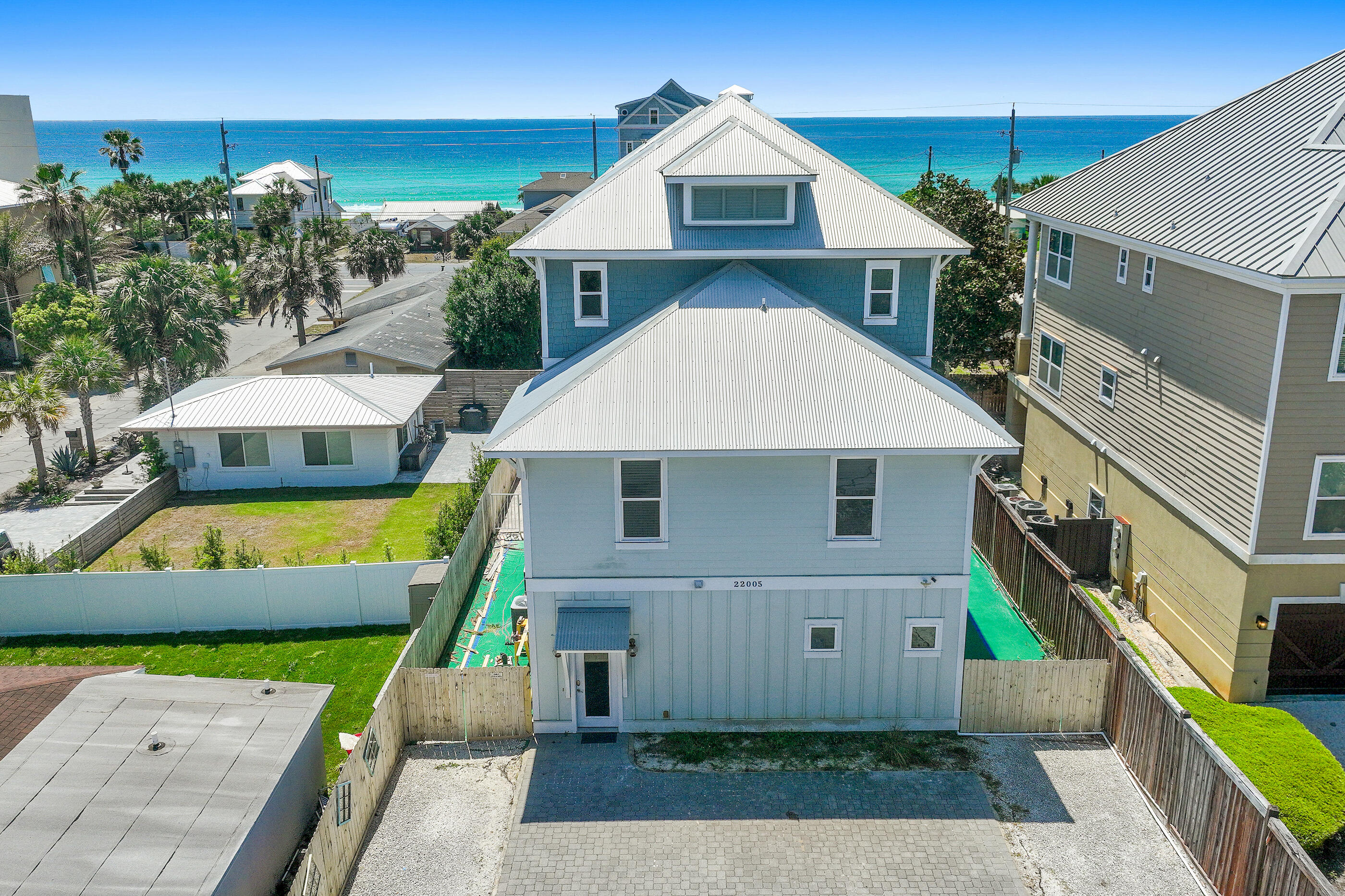 Oceanview Oasis - Luxury 6-Bedroom Retreat with Private Pool & Gulf Views in Panama City Beach.

Welcome to 22005 Belgrade Ave, a stunning single-family home perfectly positioned in the desirable Kiska Beach area of Panama City Beach, FL. This spacious 3,510 sq ft residence offers 6 bedrooms, 5 full bathrooms, and 1 half bath, comfortably sleeping up to 21 guests--ideal for large families, multi-generational vacations, or high-yield vacation rental investors. 

Step inside to discover an open-concept living area flooded with natural light, featuring a generous great room perfect for gatherings. The gourmet kitchen boasts modern appliances and ample counter space, making meal prep effortless whether you're cooking for a crowd or enjoying casual coastal dining. Multiple living spaces and three master suites provide privacy and comfort for every guest. 

Outside, unwind in your own private pool enclosed by a privacy fence--perfect for cooling off after a day at the beach. Enjoy partial gulf views from the home and easy access to the world-famous white-sand beaches of Panama City Beach. The beach is just minutes away on foot, offering convenient access to swimming, shelling, and sunset strolls.

Additional highlights include:

Built in 2016 with modern finishes throughout
Ample parking and outdoor space
Prime location near restaurants, shopping, Pier Park, 30A and area attractions
Strong rental history potential (previously generating significant income as a vacation rental)

Whether you're seeking a luxurious primary or second home, or a turnkey investment property in one of Florida's top beach destinations, Oceanview Oasis delivers unbeatable value, comfort, and coastal charm. 

Property Details:

6 Beds | 5.5 Baths | 3,510 Sq Ft
Built: 2016
Private Pool
Gulf Views
Minutes to the Beach

Don't miss your opportunity to own a piece of paradise on Belgrade Avenue. Schedule your private showing today!

This information is believed to be accurate, but without any warranty. BUYER TO VERIFY ALL DIMENSIONS, ASSESSMENTS AND ANY INFORMATION DEEMED IMPORTANT.