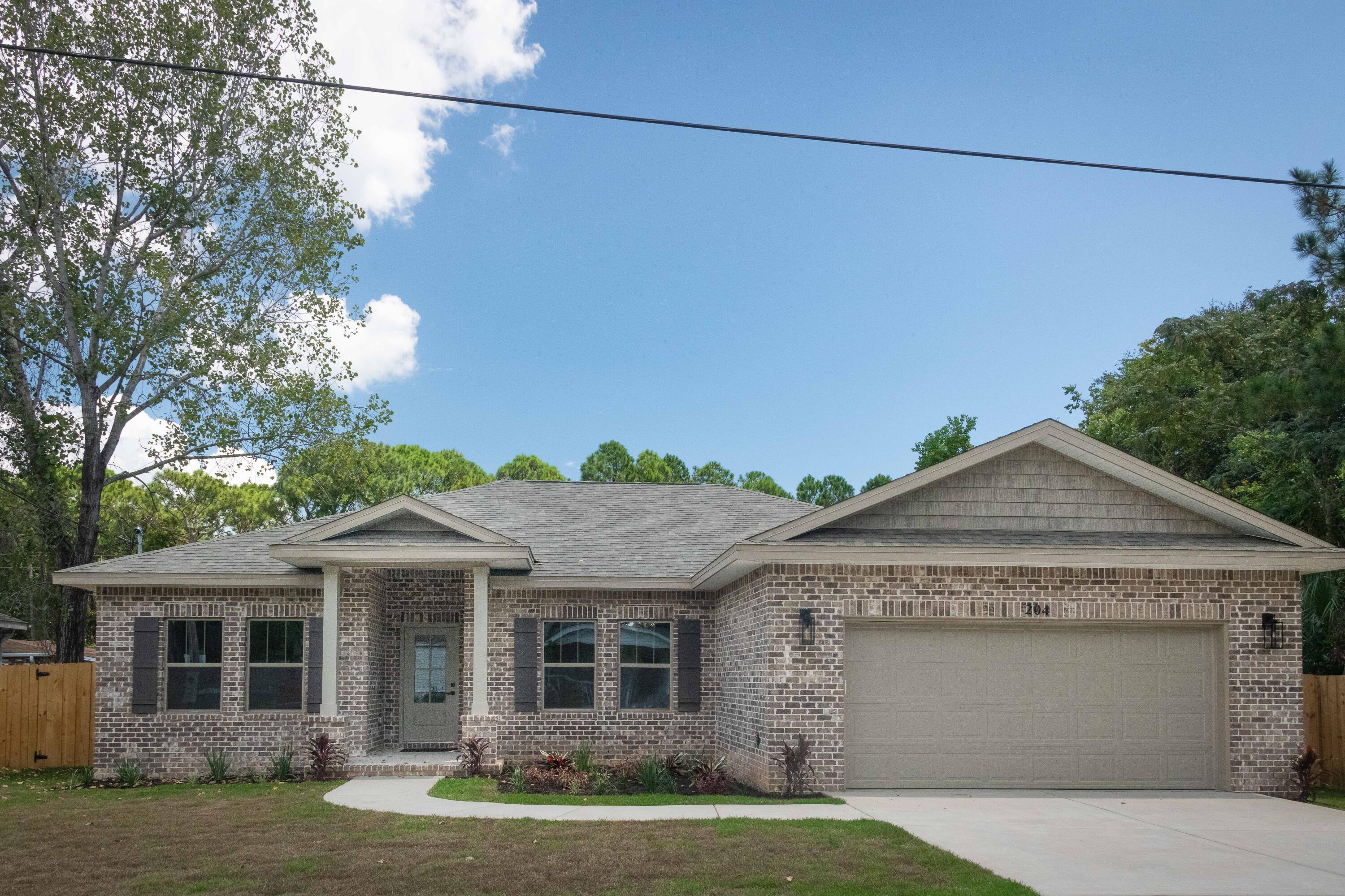 New Construction! All brick luxury home that's MOVE IN READY NOW! You don't want to miss seeing this lovely luxury home conveniently located in Mary Esther, FL. Just minutes away from Shopping, Beaches, & Military Bases.  
  
Quality construction throughout.  Builder has spared no expense filling this beautiful 4 BR, 2 Bath custom home with wonderful features throughout.

Features include: Roomy entry Foyer and Living room, Open kitchen with 9ft. island, beautiful pendant lighting, and custom shaker style cabinetry.  Quartz countertops, upgraded lighting and ceiling fans, Samsung stainless appliances and tile backsplash.  

You will love the 9ft and 10 ft. ceilings throughout, custom trim package including crown molding and 2 panel shaker style interior doors.  Primary bath has an oversized tile shower with bench seat, frameless glass shower door and Kohler gold plumbing fixtures.

Throughout the entire home there is 'Lifeproof' LVP flooring in all rooms.  There are walk-in closets, covered outdoor porch with LED lights and ceiling fan.  
     The property will be fully landscaped with a sprinkler system, fenced yard and gates.  2-car has pull down attic stairs with plywood attic storage above,   

This home has everything you could ask for and you will be sure to love it!! If you are looking for a home with lots of space and quality this one is for you. Builder 2-10 warranty is optional. This awesome home full of beautiful amenities you will be sure to appreciate. Schedule a showing soon, I promise you won't be disappointed!