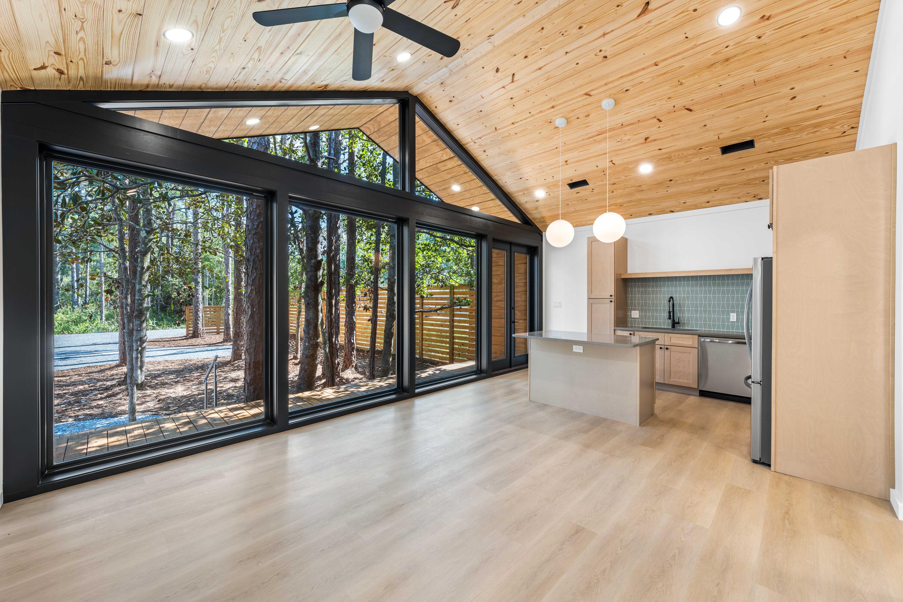 Introducing a New Standard of Living in Santa Rosa Beach, FL This newly completed residence offers a fresh take on modern living, blending clean architectural lines, natural textures, and abundant natural light. Designed with simplicity and function in mind, the home features a bright open-concept layout, vaulted ceilings with wood tongue and groove detail, and expansive Anderson windows that create a seamless connection between indoor and outdoor spaces.

Inside, you'll find durable luxury vinyl plank flooring and matching stainless steel appliances that bring both style and practicality to the heart of the home. The primary suite includes a full ensuite bathroom and a spacious walk-in closet, offering a quiet and private retreat. A second bedroom and full guest bath provide