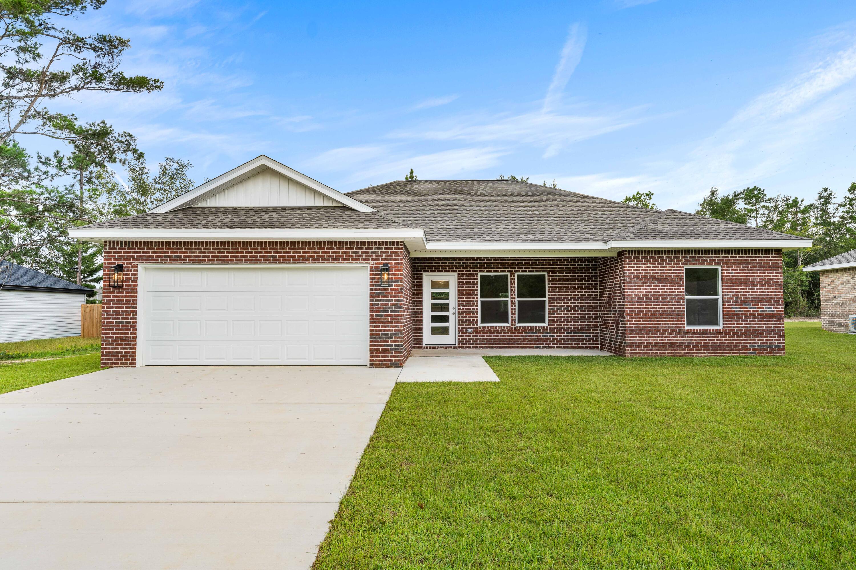 Construction is complete!  Ready to move in.  This thoughtfully designed 3-bedroom, 2-bathroom residence features a brick exterior with 2,168 under roof and 1,468 s.f. heated/cool living space.  Front and rear porches and full size 2 car garage.  The home features LVP (luxury vinyl plank) flooring throughout with tile in the bathrooms (both with tubs).  All wood, self closing, two tone cabinetry accents the open concept living and kitchen area with beautiful quartz counter tops and 93x36 island.  You'll love and enjoy the convenience of the laundry room being located accessible to the spacious private  Primary bedroom ensuite.  Two bedrooms are on the other side of the kitchen and living area with Jack and Jill bathroom.  
Ask about Builder credits and incentives that can help fund closing costs and buy downs.