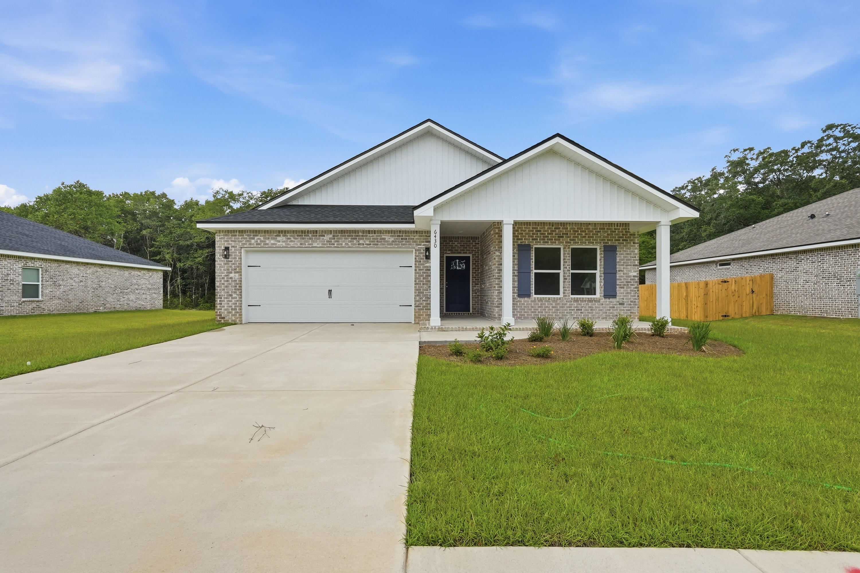 'MAYBELL II'  North side location for this all-brick home on large lot.  Front and rear porches + landscaped yard for relaxing & entertaining.  Foyer opens to family gathering area overlooking kitchen/dining area.  Work island w/bar seating, corner pantry, quartz countertops & white shaker cabinets.  Vinyl plank flooring in main areas, cozy carpet in bedrooms.  Owner's bath has double vanities, linen storage & walk-in closet.  Finished garage.  Seller will contribute up to $15,000 towards buyers closing costs (call for details).