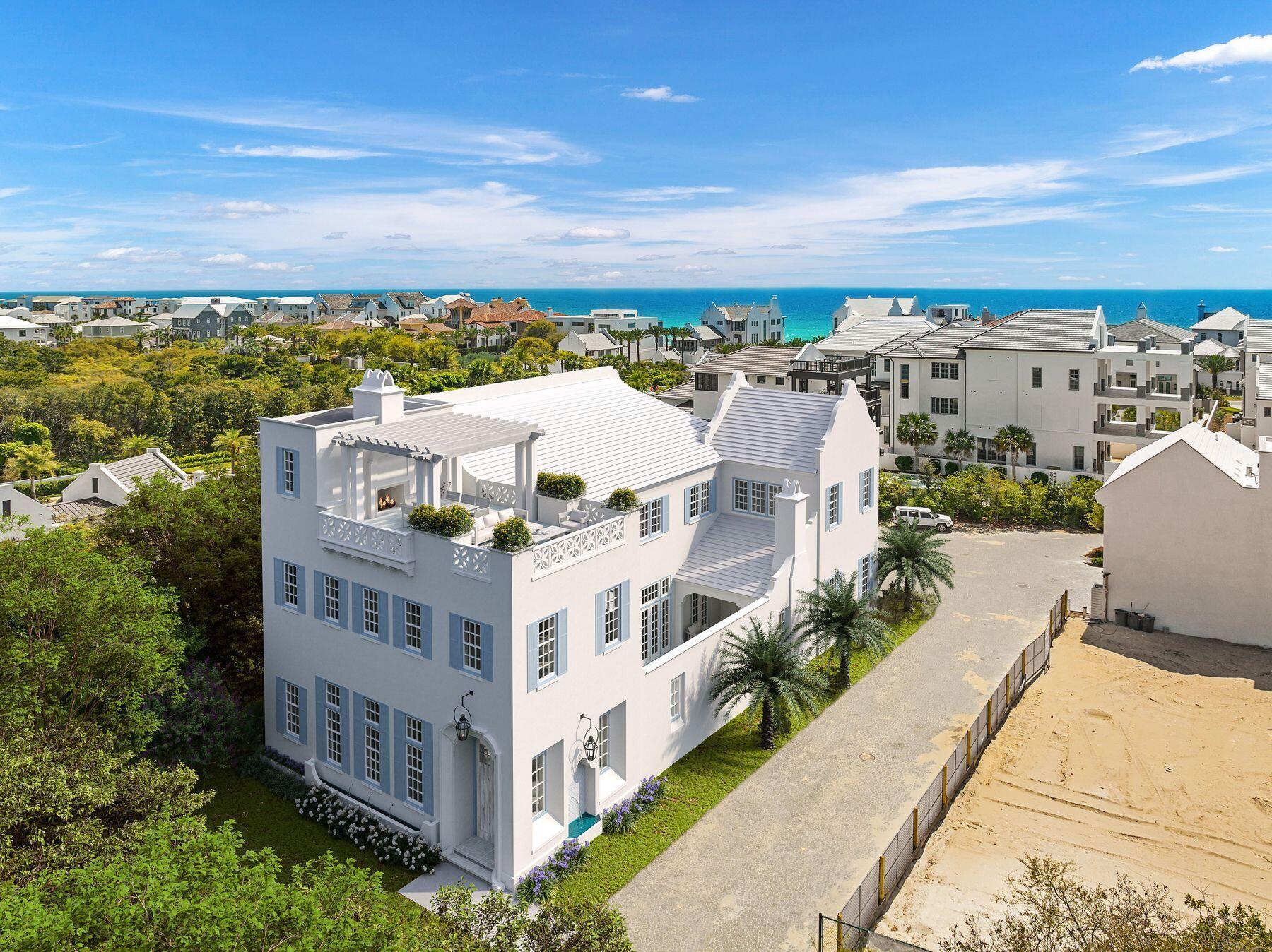 Discover this stunning new 5,908 sq ft home offering 5 bedrooms, 5 baths plus 3 half baths on a prime corner lot filled with natural light. The residence features two expansive primary suites on the second floor, two guest rooms, and an additional bedroom on the first level.
Inside, the thoughtfully designed open floor plan seamlessly connects the kitchen to the dining area, while offering both a formal living area and a casual sitting space. Elegant arched doorways flow throughout the first floor, enhancing the spacious feel. The home showcases a warm, organic aesthetic with natural stone tiles, wood beams, white oak ceilings, natural wood cabinetry, and signature Venetian plaster walls.
Step outside to a beautiful courtyard with fireplace, grill, wet bar, and pool area--perfect for entertaining. The third-floor rooftop deck is truly exceptional, complete with living and dining space, an outdoor fireplace, wet bar, half bath, and sweeping Gulf views overlooking Alys Beach to the west. Sunsets here are unforgettable.
Additional highlights include a two-car garage with potential car lifts and a convenient 3-stop elevator to the rooftop terrace. 
A rare blend of luxury, views, and livability in the heart of Alys Beach. Delivery date of early Spring 2027
