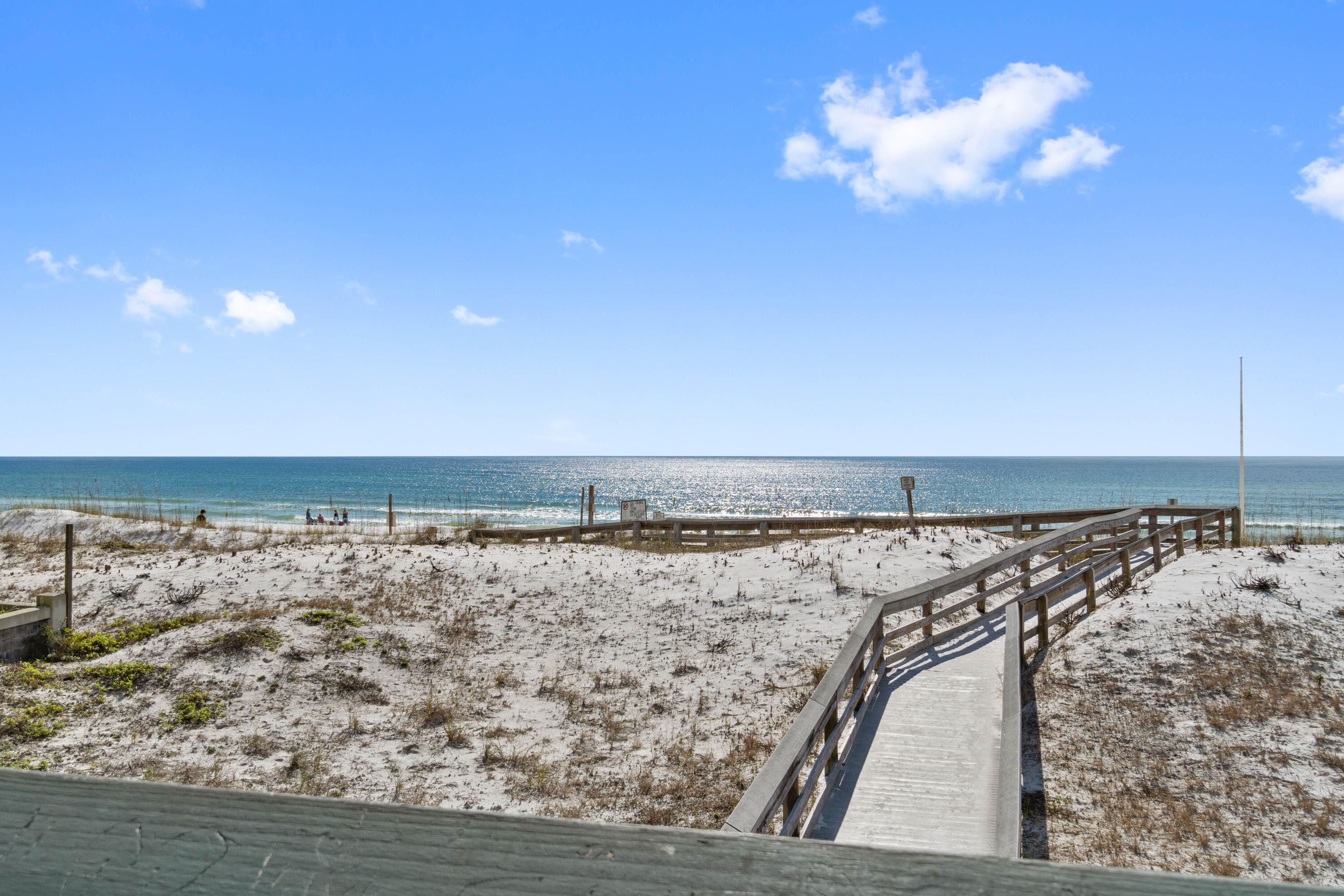 WELCOME HOME to your Beautifully and Spacious updated End Unit Condo on Okaloosa Island. Your own beach getaway to Live Where Others Vacation.  Custom Kraftmaid soft close cabinets, Breakfast Bar with pull outs, Quartz countertops, S/S Appliances, Updated Lighting & Ceiling Fans, Luxury LVP vinyl plank flooring, Impact windows & exterior steel door. No popcorn ceilings. Walking distance to Dolphin Beach Access 1 (5-10 min) on the Gulf Side via boardwalk or take the boardwalk in opposite direction to the Santa Rosa Sound. No need to drive to take your paddle board or surfboard, just walk to the beach with your board. Plenty of restaurants, shopping, the Gulfarium & the Boardwalk within walking distance or a short drive. 
Only one assigned parking space. Washer&Dryer Included . Unit is unfurnished. New roof 2024