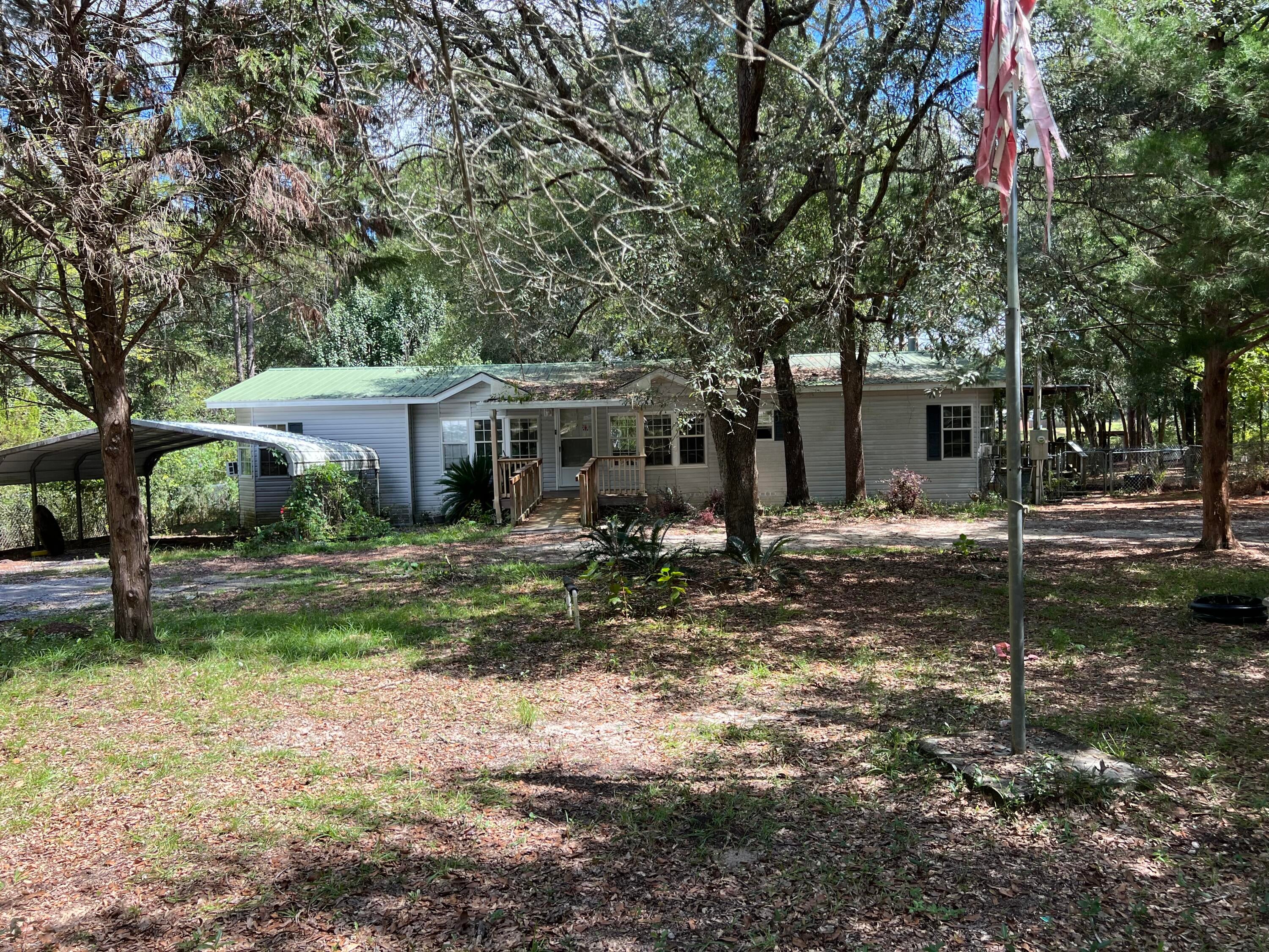 INVESTOR SPECIAL! WATERFRONT FIXER-UPPER ON IMPERIAL LAKES!

Calling all investors, rehabbers, flippers, and buyers looking for a property with serious potential! This 3-bedroom, 2-bathroom double-wide is ready for someone with a vision to bring it back to life and make the most of its fantastic waterfront setting on beautiful Imperial Lakes in DeFuniak Springs.

The home offers a spacious layout with plenty of room to reimagine, renovate, and create something truly special. A family room addition provides additional living or flex space and offers the perfect opportunity to take advantage of the peaceful surroundings. Step outside and the outdoor space really shines, with a front porch, a wrap-around back porch, and waterfront views that give this property the kind of setting that is becoming increasingly difficult to find.

Imagine sipping your morning coffee on the back porch while enjoying the lake, creating an inviting outdoor entertaining area, or simply relaxing and watching the wildlife and water. The possibilities are here- you just need the vision to unlock them!

The property also includes a storage shed, providing convenient space for tools, lawn equipment, fishing gear, and all those extras that tend to accumulate when you're enjoying waterfront living.

Yes, this one needs work, but that's exactly where the opportunity lies!