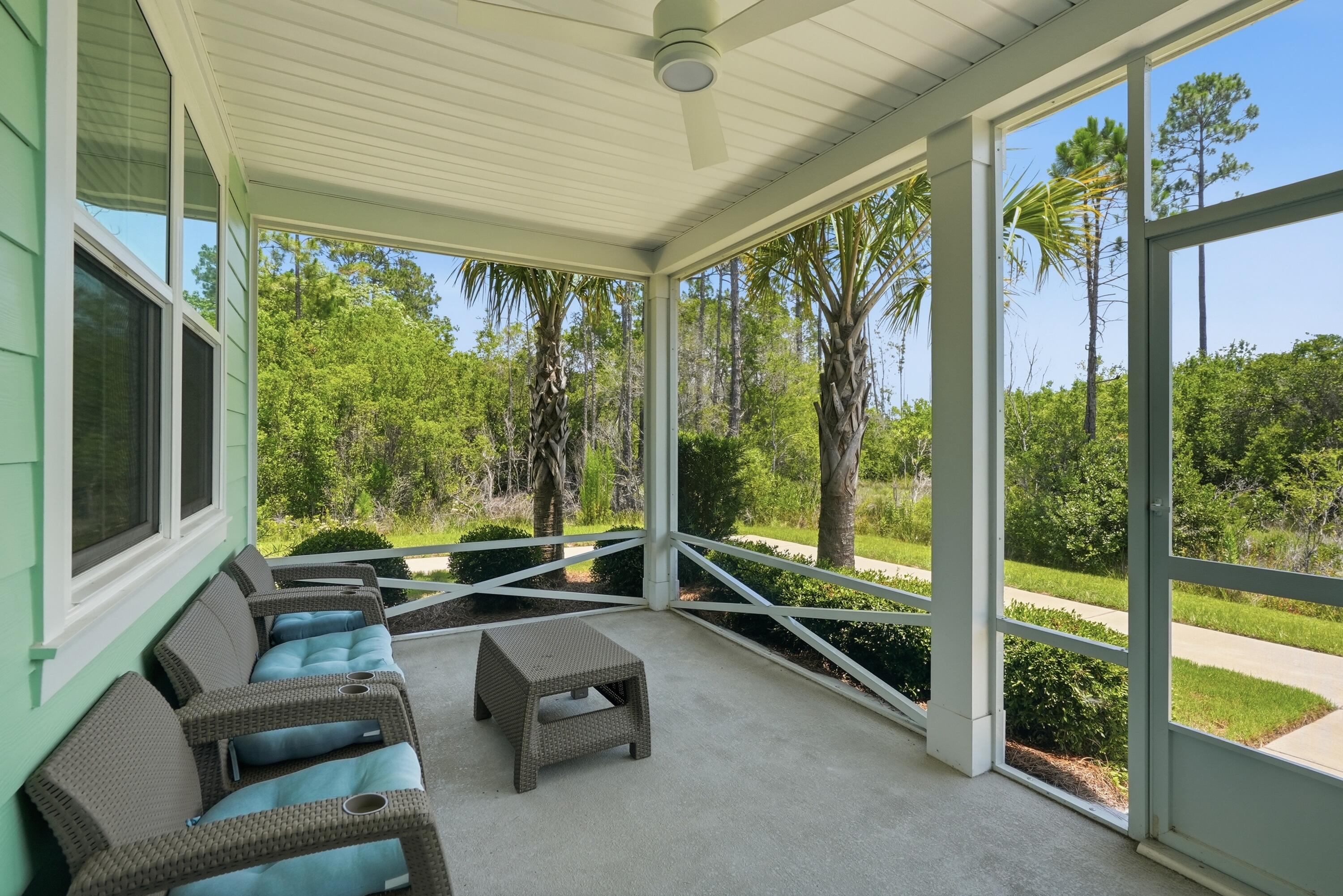 Priced to SELL! Amazing Aloha floor plan on a gorgeous private lot. Experience coastal-inspired living in this beautifully maintained Aloha Cottage located in Latitude Margaritaville Watersound. Featuring two bedrooms plus a versatile den, this popular floor plan offers flexible living space and an open-concept design that blends comfort, functionality, and style. The standout feature of this home is its exceptional location. Situated with preserve space on both sides, it offers a level of privacy rarely found among cottage homes and creates a peaceful setting surrounded by natural beauty. Enjoy morning coffee or evening relaxation from the screened porch while taking in the tranquil preserve views. Inside, the spacious great room features vaulted ceilings and abundant natural light since you can keep the blinds open and still maintain privacy. The kitchen features a large center island, quartz countertops, upgraded cabinets, tile backsplash, and ample workspace for cooking and entertaining. A dedicated dining area provides the perfect setting for gatherings. The primary suite includes a generous walk-in closet, an ensuite bath with dual vanities, and a tiled walk-in shower. On the other side of the home, the guest bedroom and full bath provide spacious accommodations. The den offers endless possibilities as a home office, hobby room, media room, or additional guest space. Quality finishes throughout include Mohawk RevWood flooring in the main living areas, tile in wet areas, custom ceiling fans, and thoughtful design upgrades. 

Beyond the home, residents enjoy access to an impressive collection of resort-style amenities, including a waterfront pool, restaurant, fitness center, indoor lap pool, spa, pickleball and tennis courts, kayaking, bocce ball, cornhole, live entertainment, and a full calendar of social activities. Additional shopping, dining, medical, and marina offerings are planned for the surrounding area, adding even more convenience and lifestyle opportunities. Located just minutes from the Emerald Coast's renowned white-sand beaches, this home combines a private preserve setting with easy access to everything the area has to offer. HOA-maintained lawn care and scheduled exterior maintenance provide a low-maintenance lifestyle, allowing more time to enjoy the community and coastal surroundings. Opportunities to own an Aloha Cottage with this level of privacy are uncommon. Come discover what makes this homesite one of the most desirable cottage locations in the Active 55+ community of Latitude Margaritaville Watersound!